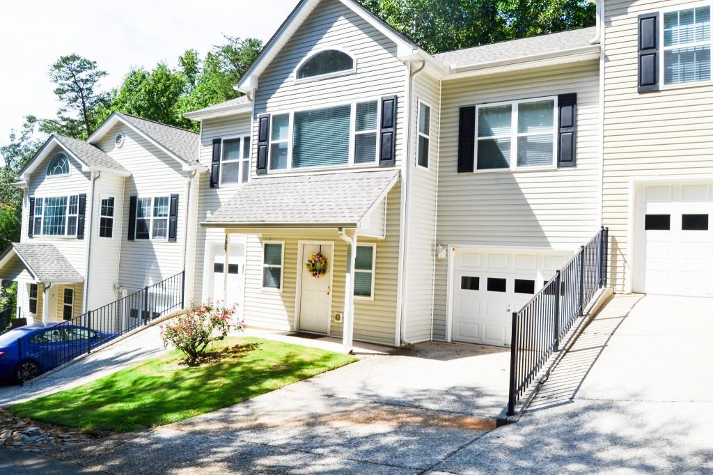 Spacious Town home with 2 oversized garages, private parking two mile from downtown Dahlonega. Roomate design with two masters new hardwood floors and a new roof. The main level has a large bonus/rec room for entertaining or home business. Convenience to the University, wine country of North Georgia and endless recreation in a roomy comfortable home.