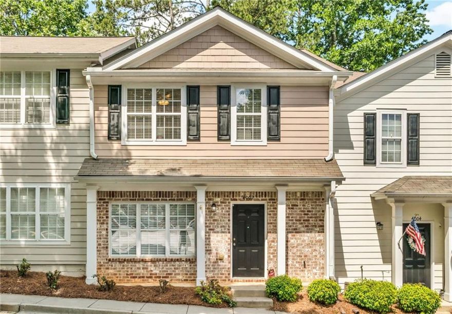 Welcome to your dream home in the heart of Alpharetta! Located in a quiet, gated community, this charming 2-bedroom, 2.5-bath residence combines comfort, style, and convenience. The bright and inviting main level features a spacious family room and separate dining area—perfect for entertaining. The kitchen boasts white cabinetry, granite countertops, and ample storage, with a seamless view into the living spaces for easy hosting and connection. Step outside to your private, fenced patio with custom stonework—an ideal spot for morning coffee or evening gatherings. Upstairs, enjoy a thoughtfully designed split-bedroom layout, each with its own ensuite bath for ultimate privacy. The spacious primary suite offers a luxurious bath with a double vanity, whirlpool tub, and separate shower. An upstairs laundry room adds everyday ease. Additional upgrades include newer HVAC system and modern stair railing, enhancing both comfort and style. Refrigerator, washer and dryer are 9 months old and hot water heater is 6 months old. All of this is just 1.5 miles from vibrant Downtown Alpharetta and within walking distance to Wills Park and Mid Broadwell Park. Quick access to GA400, Avalon, Downtown Crabapple, shopping, dining, and entertainment makes this location unbeatable.