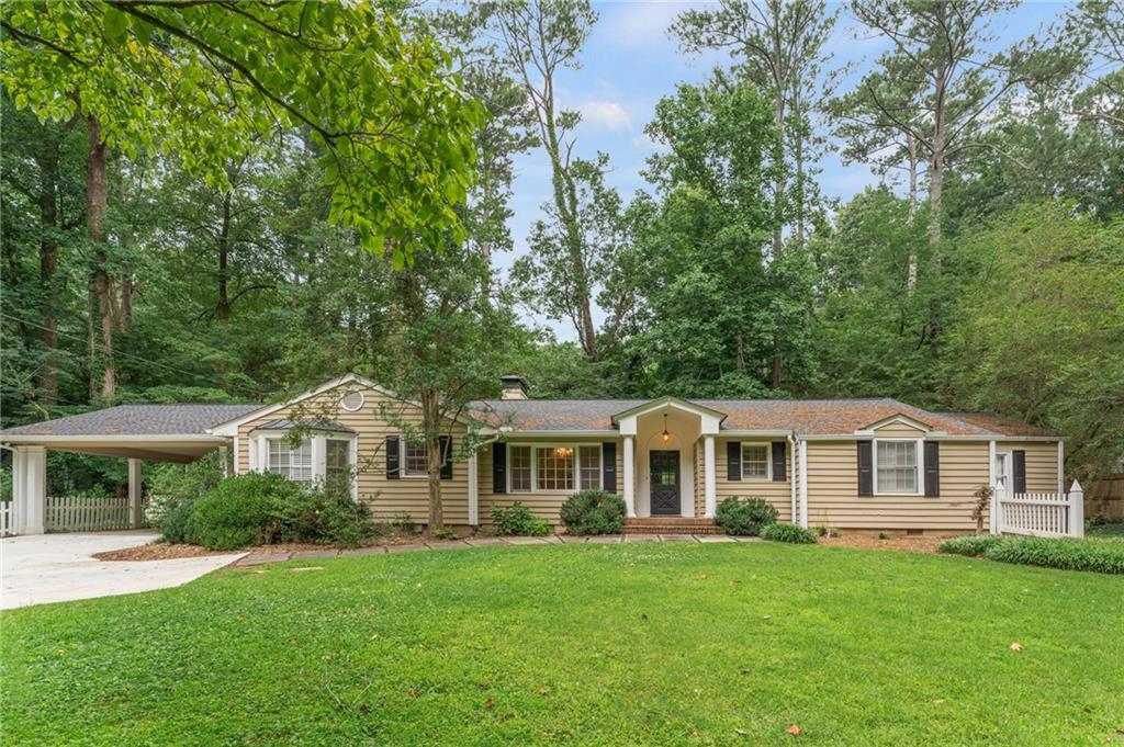 Large one-level home with 3 large bedrooms and 2.5 bathrooms. The living space includes a formal front entry, a separate dining room, a large fireside family room, and a bright open kitchen with a large breakfast room that leads to a bonus/sun room. Off of the kitchen is a full laundry room, 1/2 bath, and direct access to the two-car carport with bonus closet storage. The primary suite features 2 walk-in closets and an updated bathroom with double vanity. Two additional bedrooms and a large additional bathroom with double vanity finish the interior. The entire home features hardwood flooring and there is a wall of windows across the back of the living space that overlooks a private patio. Located on a dead-end street with no through traffic and only half a mile to the Morris Brandon main campus and Sutton 7th/8th grade campus. Located close to restaurants, shops, and the Northside public library with very quick access to the highway. Pets are allowed with prior approval and a pet deposit. When current tenants completely move out, the home will have a deep cleaning. The property is available on August 1st!