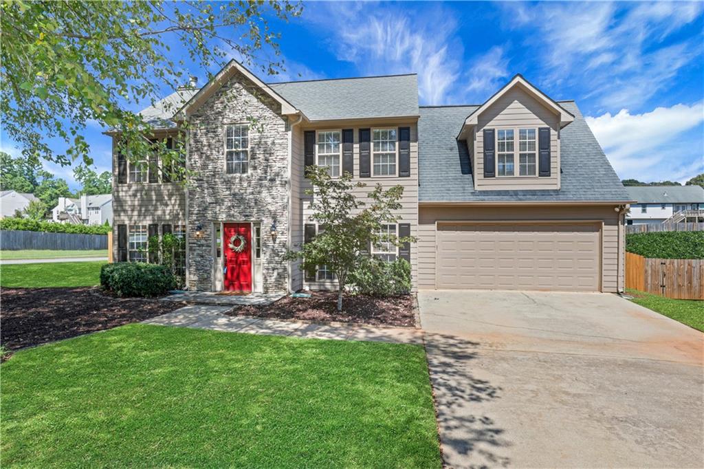 Move right in to this well maintained home in the coveted community of Towne Lake Hills South. Perfectly nestled on a large, corner lot with a huge fenced back yard perfect for the kids and pets to roam. Street ends at a cul-de-sac, for even more privacy. This spacious home boasts 4 bedrooms and 2 1/2 baths with a large family room anchored by a beautiful stone fireplace. Formal living room has built in bookshelves. Luxury vinyl flooring throughout entire home. Kitchen includes a pantry plus an additional large walk in closet for cleaning supplies or could easily convert to more pantry space. Oversized master has his and hers closet and master bath has separate tub and shower. Don't miss the workshop off the garage, which has a door leading to the amazing back yard. There is so much to love about this house, including its prime location convenient to shopping, dining, highway access and just minutes to the historic Main Street district. The popular downtown Woodstock area has multiple restaurants, bars and shops and hosts many regular events like concerts, farmers markets and so much more. See it in pics!