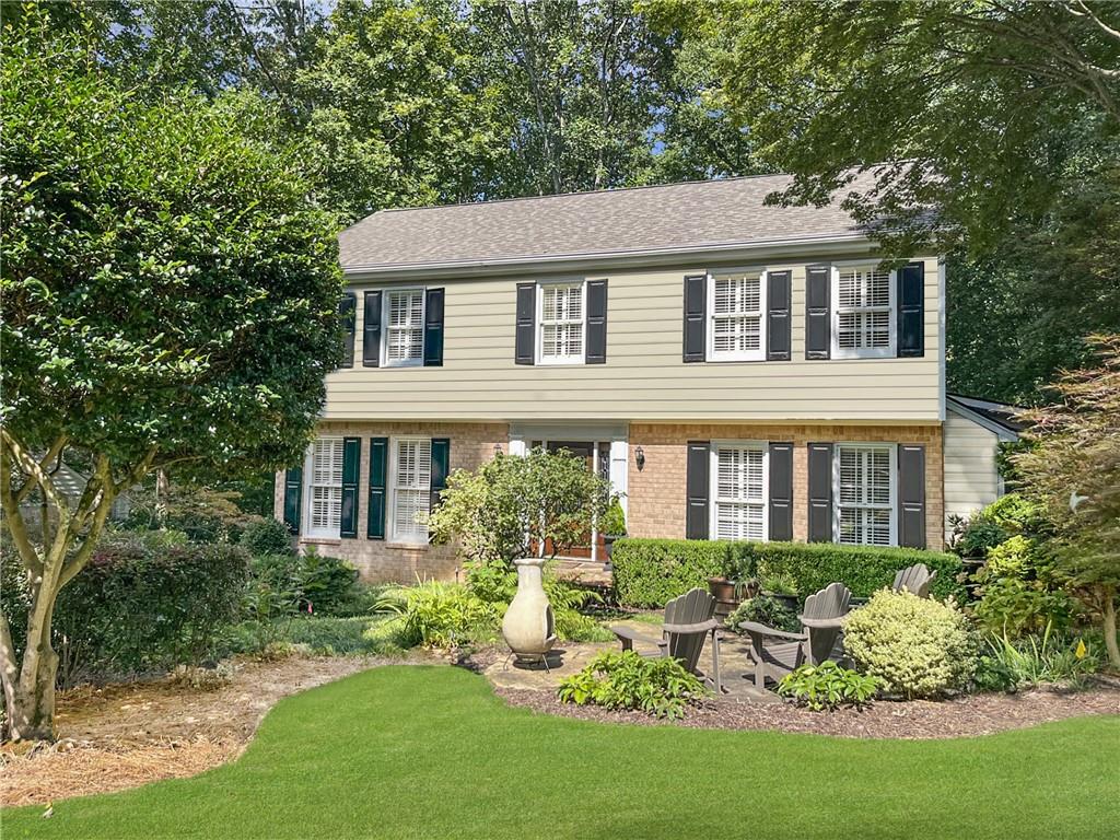 This gorgeous traditional home on a quiet cul-de-sac is completely turn-key and ready for its new owners! Ideally located in East Cobb with top-rated schools, this home sits in a lovely neighborhood with fantastic amenities including a pool, tennis courts, and sport court. Inside, you'll find fresh paint, plantation shutters, and an open, inviting flow. The beautiful white kitchen features granite counters, stainless steel appliances, an island, and plenty of storage. A light-filled sunroom addition provides extra living space on the main floor. The master suite boasts a stunning updated bath and his & hers closets. Additional baths have been stylishly updated as well. The finished basement offers endless flexibility for a private office, movie room, playroom, or gym. Outside, enjoy mature professional landscaping and a manicured path that leads directly to the neighborhood pool and playground. The covered deck with a cozy fireplace makes the perfect spot for year-round entertaining or relaxation.