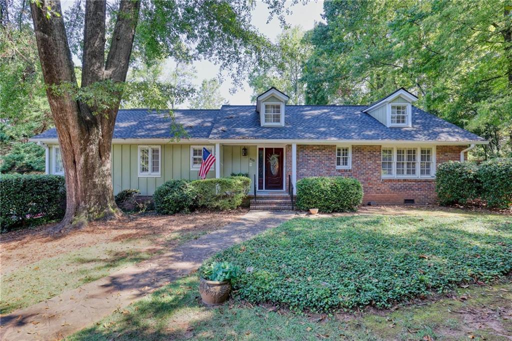 Charming Cape Cod Cottage with Guest House in Whitlock Heights! Discover this hidden gem in the highly sought-after Whitlock Heights neighborhood of Marietta! This enchanting Cape Cod-style cottage is a standout on its own, but when you add in the stunning outdoor entertaining area, complete with a heated in-ground pool, hot tub, and a cozy stone fireplace overlooking the golf course, you’ve found the ultimate retreat! The main home combines the convenience of one level living with plenty of room to spread out in the open living spaces that are accentuated by hardwood floors throughout, beautiful built-in cabinetry and large windows that frame picturesque views and provide an abundance of natural light. The spacious primary suite has been thoughtfully extended to include a relaxing sitting area, a generous walk-in closet, and a luxurious bathroom boasting vaulted ceilings, a clawfoot tub, a large shower, and a double vanity. The impressive guest house, built in 2007, offers an inviting open-concept layout on the first floor, complete with a modern kitchen, a fireplace, and ample room for entertainment—perfect for hosting friends or family. Upstairs, you’ll find two comfortable bedrooms and a full bath, ensuring privacy and convenience for your guests. Both homes have been meticulously maintained, featuring roofs that are just one year old. The main house also includes a drive-under two-car garage and ample unfinished storage space in the basement, plus a cedar closet and additional washer/dryer hookups for your convenience. Don’t miss your chance to own this exceptional property where charm meets modern amenities in a stunning setting. Schedule your showing today! *Unable to provide drone photos due to restricted air space. Lot size is inaccurate in tax record - it is approximately 3/4 acre.