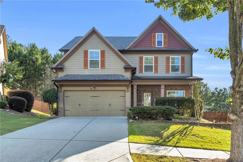 Welcome to 6126 Barker Landing in Sugar Hill, GA! This beautifully maintained home offers an open-concept layout filled with natural light, featuring a spacious family room, and a modern kitchen with granite countertops, stainless steel appliances, and a large island. The main-level owner’s suite boasts a spa-like bathroom with dual vanities and a walk-in closet, while additional bedrooms upstairs provide flexibility for guests, office space, or a growing family. Enjoy outdoor living with a covered back porch and a private, landscaped yard perfect for relaxing or entertaining. Located in a quiet, friendly neighborhood just minutes from top-rated schools, Gary Pirkle Park, shopping, and major highways—this home combines comfort, style, and convenience in one perfect package.