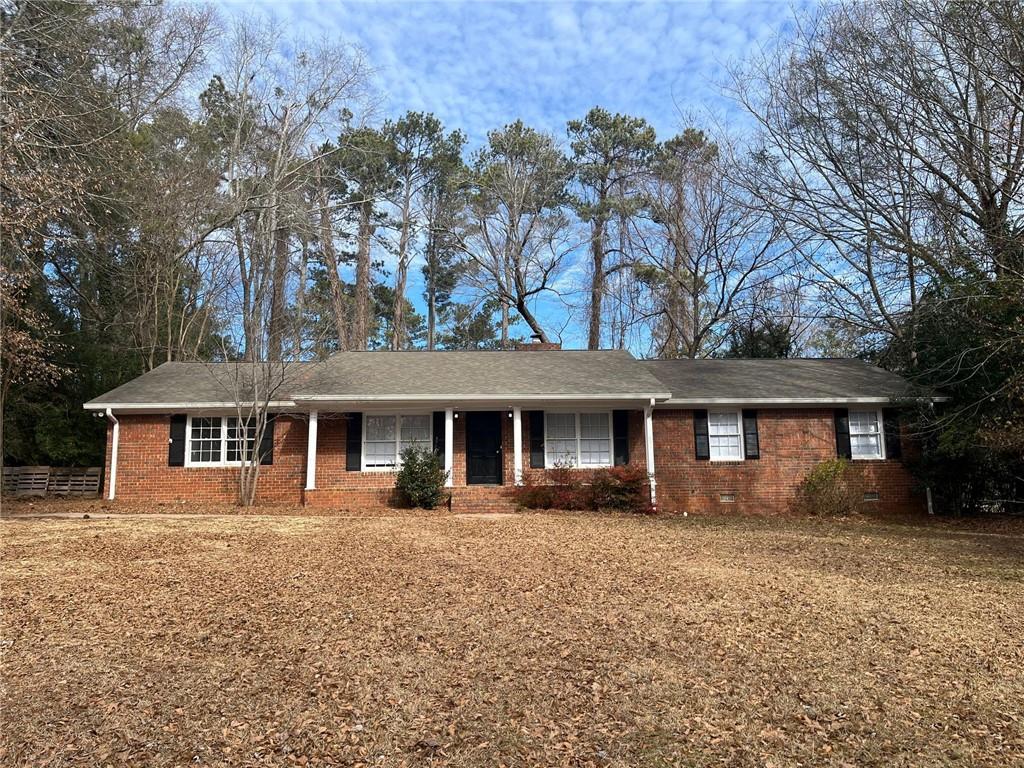This stately brick ranch home is nestled on a lovely lot and offers a welcoming atmosphere with a thoughtfully updated, open floor plan. Featuring a spacious living room, separate dining room, and a cozy family room with a brick fireplace, this home has plenty of room to relax and entertain. The well-sized bedrooms are complemented by a versatile bonus room off the kitchen, ideal for an office or extra living space. Two full bathrooms and brand-new, beautiful flooring throughout add to the appeal, along with stainless steel appliances and sleek granite countertops in the kitchen. With its inviting layout and modern updates, this home truly feels like a perfect fit. Conveniently located near shopping, dining, recreation, and entertainment, it’s the ideal place to call home.