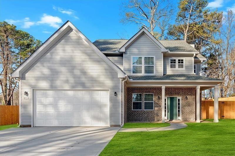 LOCATION, LOCATION, LOCATION!! Welcome to your dream home! This exquisite new construction is ideally situated in the heart of Douglasville. Just steps from a wide array of shopping, dining, and entertainment options, and with easy access to I-20, everything you need is right at your fingertips. As you step inside, you'll be greeted by an inviting foyer that leads to an elegant formal dining room, perfect for hosting guests. The open-concept kitchen and living area create a seamless flow. Turn on the cozy fireplace with the flip of a switch! The chef-inspired kitchen boasts sleek quartz countertops, an island for extra space, and Samsung stainless steel appliances. Upstairs, you'll find 4 spacious and sunny bedrooms, including the luxurious primary suite. This private retreat features his & her closets, double vanity, spa-like soaking tub, and a beautifully tiled walk-in shower. Outside, the nearly half-acre corner lot is fully fenced with gorgeous cedar wood, providing ample greenspace and endless possibilities for outdoor living & entertaining. This beautifully crafted home is brand new and ready for you to make it your own. Don’t miss out on this incredible opportunity to live in modern luxury with the perfect combination of location and style!
