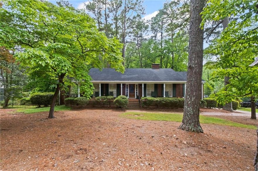 This is your chance to get a full 1 acre property in Whitlock Heights!  Enjoy the convenience and prestige of this sought after neighborhood.  Just imagine sitting on this expansive covered front porch with your favorite beverage watching the days turn into night without a care in the world.   Or make the quick walk/ride to Marietta Square for an evening out.  You could also be enjoying your large sunroom and FINISHED BASEMENT with FULL KITCHEN and bath.  This home has more space than most in the neighborhood.  Come see it before it's gone!