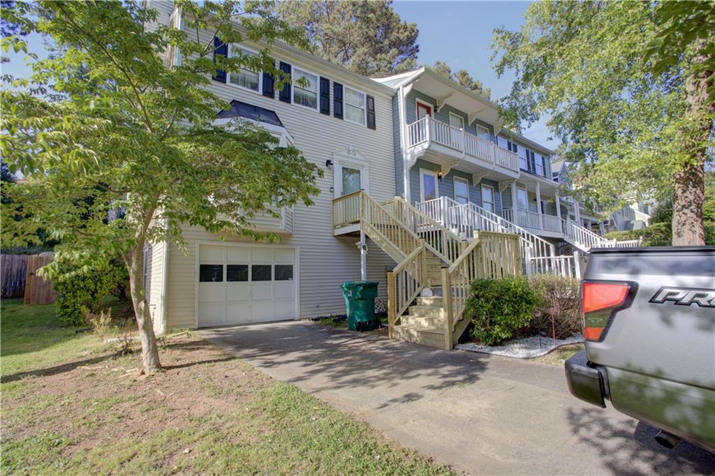 Fabulous, renovated townhome in Afton Downs! A short walk to the Battery, restaurants and shopping! No HOA in this community, a voluntary $25 annual contribution to beautify the entrance, NO RENTAL RESTRICTIONS. This beautiful home is brimming with updates and upgrades! 2021 New Light Fixtures, New Washer Connections, Hardwood Floor refinished, Fresh Paint...2022 New Roof, New Fence and Extended Yard to Property Line, New Furnace, New Ecobee Thermostat, New Front Steps! All of the work has been done! Lovely kitchen and dining area opens to the back deck with private fenced yard! Spacious living room with cozy fireplace. 2 master suites up with gorgeous updated fixtures. Oversized garage with Finished bonus room and laundry on the lower level. A MUST SEE! Great investment opportunity to live in the heart of Smyrna, or AIRBNB!