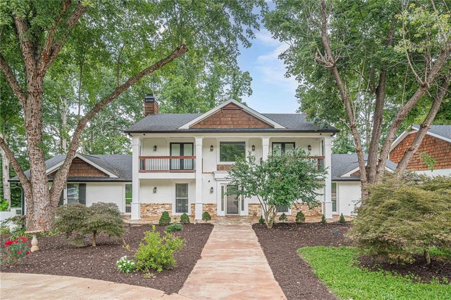 ***OFFERING $40k towards Kitchen remodel*** Immaculate designer home is perfect for entertaining and in pristine condition. Sitting on a private estate-sized lot on a quiet section of South Cherokee Lane, this captivating Estate with 5 bedrooms & 4.5 baths offers exceptional detail throughout & is ideal for hosting family & friends. Features include a chef's kitchen with stone & butcher block counters, top of the line Viking appliances, a keeping room with hammered copper accented fireplace, an enormous main-floor master suite, & a large sun-drenched family room with a barrel-shaped ceiling. All new interior paint, and fixtures throughout. The terrace level offers a full kitchen, new bathroom, family room with 2nd fireplace, 1 or 2 bedrooms or potential home theater, a 2-car garage, and a separate driveway. The detached 2 car garage is climate controlled with a huge 500+ Sqft finished room above. The gated back yard is perfect for parties and includes an inground pool with stone accents, and an outdoor fireplace. No HOA!