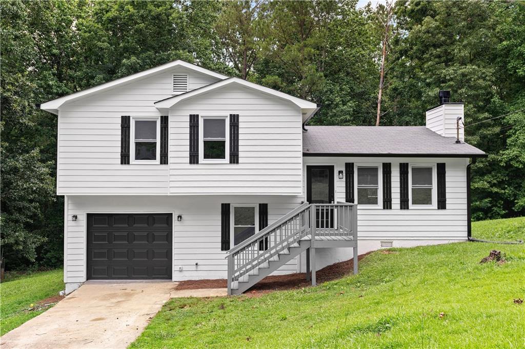 Beautifully upgraded home in Newnan! Walk into the spacious and open living room with new LVP flooring throughout. The kitchen has been upgraded with new cabinetry, new countertops, and new stainless steel appliances, all overlooking the family room and private back yard. You'll find every bedroom and bathroom have been completely upgraded as well, including new flooring, paint, new vanities, new toilets, and new counter tops. The oversized garage is perfect for almost any use, storage, workshop, the list goes on! When you're tired of being inside, enjoy your spacious and open, yet private backyard. Check this beauty out today!!