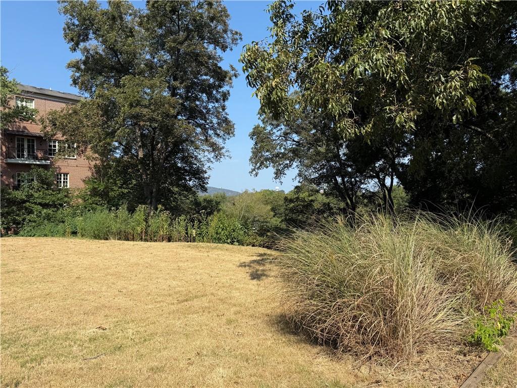 Walk to Marietta Square! Situated on a quiet street between beautiful Washington Avenue Commons Condominiums and a home converted into a law office, these lots offer views of Kennesaw Mountain and are across from the National Cemetery. Two parcels (379 and 389 Washington Avenue) being sold together for a total of just over half an acre. Zoned OI. Vacant land.