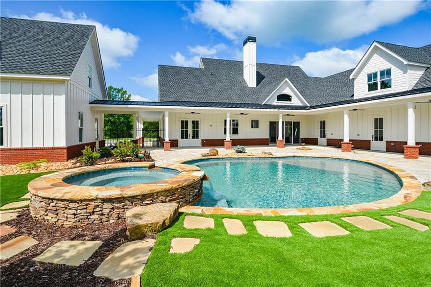 SELLER MAY CONSIDER SUBDIVIDING! RARE AND IMPRESSIVE NEW CONSTRUCTION FARM HOME WITH POOL, 4-CAR GARAGE, IN-LAW SUITE WITH MULTIPLE POLE BARNS, PASTURES, STORAGE AND A SECOND 5 BEDROOM 5 BATH MODULAR HOME, WITH 2 KITCHENS, PLUS A TINY HOME (CURRENTLY STORAGE) ON 145+/- BEAUTIFUL ACRES ONLY MINUTES TO AMAZING RESTAURANTS AND SHOPPING IN CANTON GA. 1 HOUR TO HARTSFIELD JACKSON AIRPORT, 1.5 HOURS TO CHATTANOOGA TN, 30 MINUTES TO CARTERSVILLE GA AND ABOUT 50 MINUTES TO ELLIJAY GA. MAIN BARN HAS 100x40 UNDER ROOF WITH CONCRETE FLOORS, GARAGE DOORS AND 4 RUNS PLUS 2 FEED ROOMS! THERE'S AN 80x60 PULL-THRU POLE BARN FOR YOUR MOTORHOME, RV'S, TRACTORS AND TOYS -- CONTAINER STORAGE UNIT AND 2-STORY TINY HOME BEING USED FOR STORAGE COULD BE USEABLE WITH SOME MODIFICATIONS. PROPERTY IS ROLLING AND BEAUTIFUL WITH ACCESS ON ADDINGTON, 140 AND SALACOA ROAD. THE NEW CONSTRUCTION HAS BEEN METICULOUSLY PLANNED AND THOUGHTFULLY DESIGNED FOR THE ULTIMATE IN FARM LIFE ENJOYMENT AND RELAXATION. OVERSIZED 2-CAR GARAGE AT KITCHEN SIDE OF HOME HAS BUILT-IN CABINETS AND DRAWERS, PLUS A WASH BASIN SINK AND OPENS TO POOL AREA. GARAGE ENTERS TO FULL-SIZED "PANTRY ROOM" WITH BUILT-IN SHELVES AND CABINETRY. THE MORE THAN AMAZING KITCHEN HAS THE LARGEST CAMBRIA COUNTERTOPS THAT YOU CAN IMAGINE WITH UPGRADED FAUCETS AND LARGE CERAMIC FARMHOUSE SINK. MASSIVE ELECTROLUX BUILT-IN STAINLESS STEEL REFRIGERATOR, MATCHING STAINLESS SHARP MICROWAVE AND ASKO DISHWASHER COMPLIMENT THE PRO-LINE ILLVE 6-BURNER + GRIDDLE GAS STOVE AND OVEN. PROPERTY SERVICED BY TWO 500 GALLON PROPANE TANKS FOR COOKING, POOL HEATER AND BACKUP GENERATOR! THIS HOME IS SURROUNDED BY COVERED PORCHES AND THE AMAZING POOL AREA IS NO EXCEPTION, WITH RELAXING SEATING AREAS UNDER SHADE, WITH WATERFALL FEATURE AND LOUNGING SHELF, ARTIFICIAL TURF SURROUNDS POOL AREA FOR LOW MAINTENANCE. GUEST HOUSE OR IN-LAW SUITE HAS 2 OVERSIZED GARAGES WITH BUILT-IN CABINETS AND OVERLOOKS POOL AREA -- BATH STUBBED BUT SPACE IS UNFINISHED BUT SHEETROCKED -- AMAZING STORAGE OR GAME ROOM, HERE IS A LIST OF THE FEATURES OF THIS PROPERTY WHICH BENEFIT THE NEW OWNERS: 2 feed rooms. Separate run-in shed in one pasture. 2 other sheds. Container for storage with electric. Small storage building with electric. 2 story building with kitchen area that needs a few items to be an apartment. Block building for storage with electric. House with 5 bedrooms and 5 baths and 2 kitchens. Landscaping at house with pool. Trails already cut thru out the property. Roads thru out the property. Very private, there are 26 acers of fenced pasture. Over 1,700 feet of potential commercial road frontage on State Route 140. Over 1320 feet of road frontage on Salacoa Road. Over 210 feet of road frontage on DeBord Drive. Custom Blinds in whole house. Heated towel racks in Master Bath and other downstairs bath. Ceiling fans in all rooms. Master bedroom opens onto pool area. All baths have custom tile. All baths have frameless glass shower enclosures. Walk-in spa tub in master bath. Two master bedroom closets. Custom cabinets thru out the house. TV in master bedroom, master bath, downstairs bedroom, downstairs bath, great room, and office. Cambria Quartz surfaces in kitchen--counters and backsplash. Drawer microwave. Built in freezer and refrigerator. Beverage refrigerator. Ilvie dual fuel range. Large walk-in pantry. Granite top on vanity in powder room. Large mud/laundry room. Office with custom built-in desks and cabinets. Lots of closets. 2 bedrooms with bath each upstairs. Porch upstairs with tile floor. Marvin fiberglass windows and doors. Mahogany grand entry door. Huge finished bonus room. All concrete finished with the Guardian finish--garages, porches, and parking pads Pool with amazing waterfall Hot tub. Cabinets in both garages. Detached garage has apartment fully finished. Washer dryer stack in apt. Separate heat and air in apt. 145+-AC Barn concrete floor--5 garage doors in barn. Run in areas for animals.