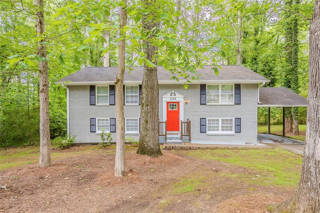 Welcome home to this move-in ready, spacious 5-bedroom, 2-bathroom split-level gem in Marietta! A charming red front door opens to a split level entryway, leading upstairs to a bright living room with ceiling fans and a kitchen featuring white cabinets, stainless steel appliances, and gas burners. The upper level also includes a full bathroom with a tub/shower combo and three comfortable bedrooms.
Downstairs offers a second living area, two additional bedrooms, a full bathroom with a shower, and a separate utility room housing the water heater—perfect for added storage or a workspace. Outside, enjoy the backyard with trees and a cement patio, ideal for relaxing or entertaining, and a front yard with plenty of green space. A long driveway leads to a covered carport, completing this well-maintained home in a convenient location. Book your tour today!
