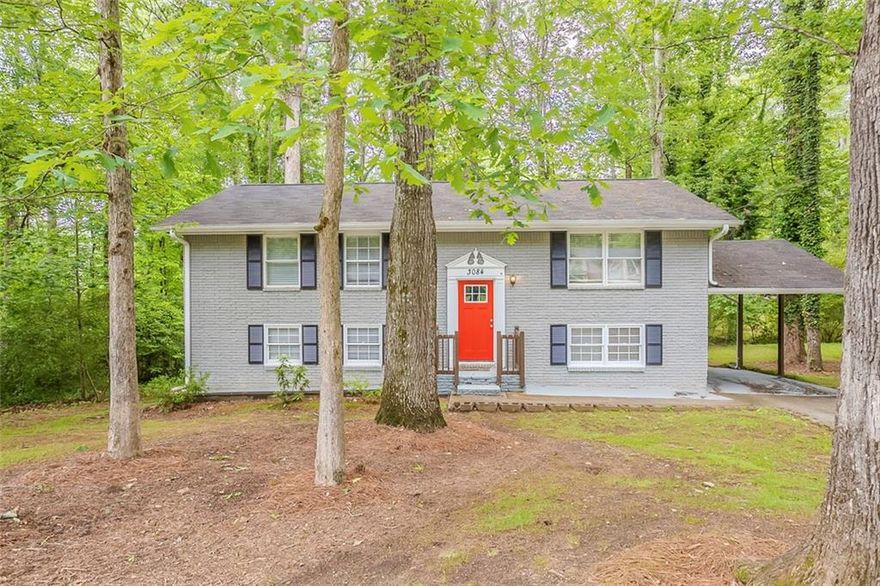 Welcome home to this move-in ready, spacious 5-bedroom, 2-bathroom split-level gem in Marietta! A charming red front door opens to a split level entryway, leading upstairs to a bright living room with ceiling fans and a kitchen featuring white cabinets, stainless steel appliances, and gas burners. The upper level also includes a full bathroom with a tub/shower combo and three comfortable bedrooms.

Downstairs offers a second living area, two additional bedrooms, a full bathroom with a shower, and a separate utility room housing the water heater—perfect for added storage or a workspace. Outside, enjoy the backyard with trees and a cement patio, ideal for relaxing or entertaining, and a front yard with plenty of green space. A long driveway leads to a covered carport, completing this well-maintained home in a convenient location. Book your tour today!