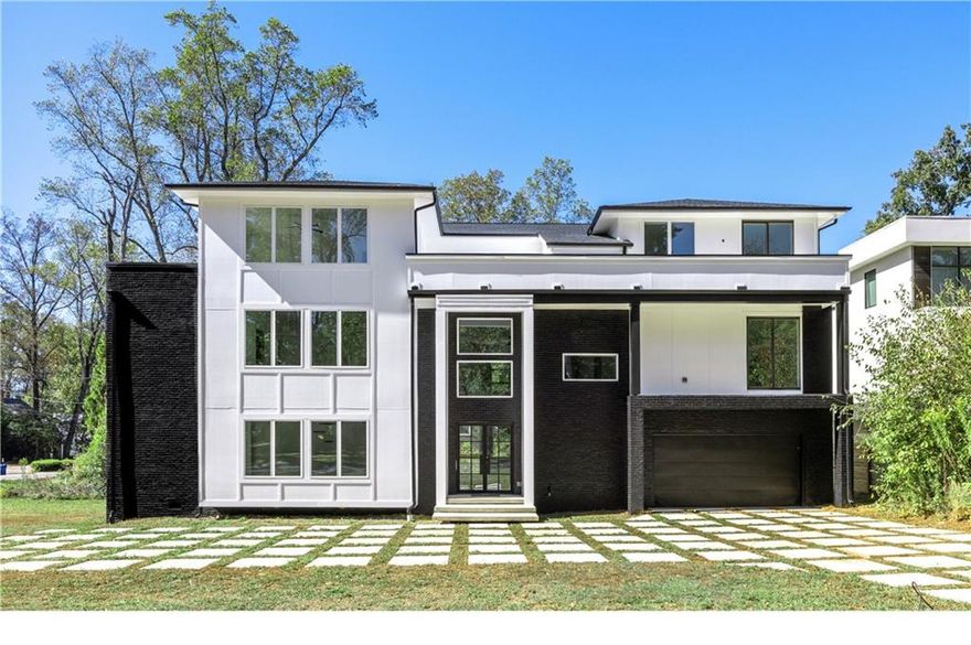1410 LaVista is an incredible opportunity ready to be customized to suit your lifestyle. Situated in LaVista Park— one of Intown’s most desirable neighborhoods, you'll find large lot sizes and an amazing sense of community and unmatched centrality to Emory, CHOA, the CDC, Midtown, and Buckhead. Step inside to soaring ceilings and open-concept living creating a bright atmosphere perfect for both everyday living and entertaining. The stunning kitchen is flooded with natural light highlighting sleek modern design. Features include custom cabinetry, massive waterfall quartz island and backsplash, dual faucet sink, views to the living room, and walk-in pantry connecting to elegant formal dining. Floor-to-ceiling windows featuring sliding doors lead out to an open deck ideal for sunlit lounging or al fresco dining. Spacious flat yard with tree-lined street providing privacy. Convenient guest bedroom on main with full bath access adjacent to a spacious three car garage and elevator-capable design to all three levels. Upstairs, the expansive primary suite is a true sanctuary with plenty of space for a sitting area. Featuring a spa bath with dual rain shower, freestanding soaking tub and spacious walk-in closet. The primary suite is separated by a spacious open loft leading to two additional bedrooms. Third level features two private rooftop terraces, two additional bedrooms—each with access to a full bath—plus a media room, laundry room, and office space offering flexibility. Don’t miss your opportunity to complete this extraordinary luxury home in one of Atlanta’s premier neighborhoods!