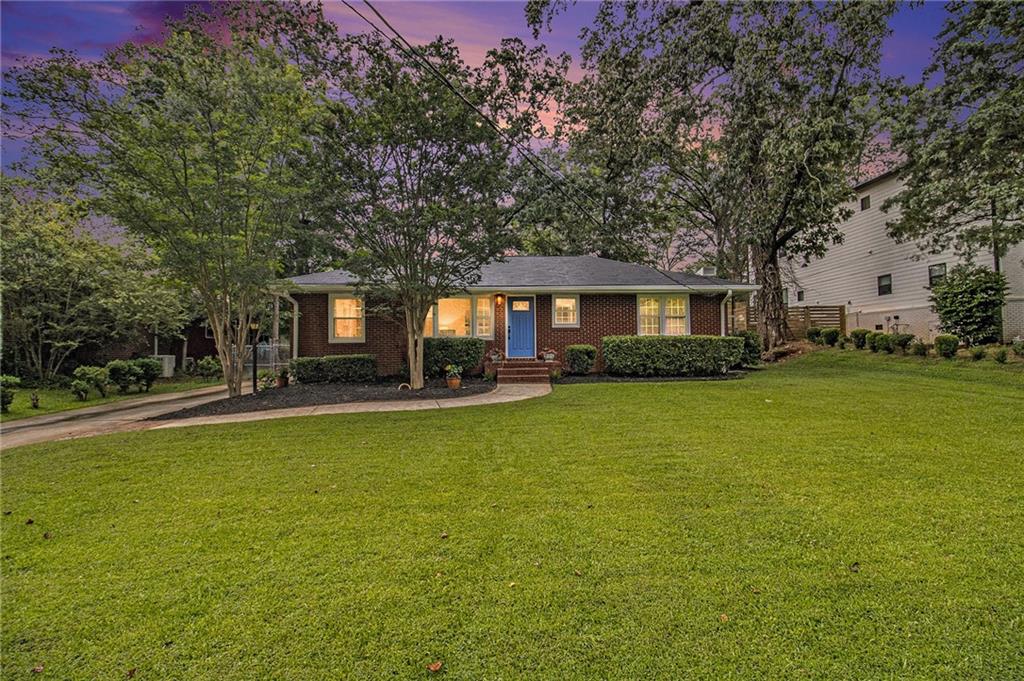 Welcome to Historic College Park! Nestled on one of the neighborhood’s most desirable streets, this beautifully maintained brick ranch offers charm, convenience, and modern updates. Just a short stroll to Barrett Park and the renowned Woodward Academy Primary School, the location is hard to beat.
This move-in ready home features a newer roof, updated HVAC systems, and freshly renovated bathrooms. The spacious primary suite includes a double vanity with granite countertops, generous storage, a walk-in closet, and a secondary closet. Original hardwood floors have been lovingly preserved throughout the main living areas and bedrooms, adding timeless character.
The oversized two-car garage includes a built-in workshop area—perfect for extra storage, creative space, or weekend projects. Enjoy the community’s rich history, local eateries, and scenic green spaces, all just minutes from vibrant Downtown College Park. Don’t miss this exceptional opportunity!