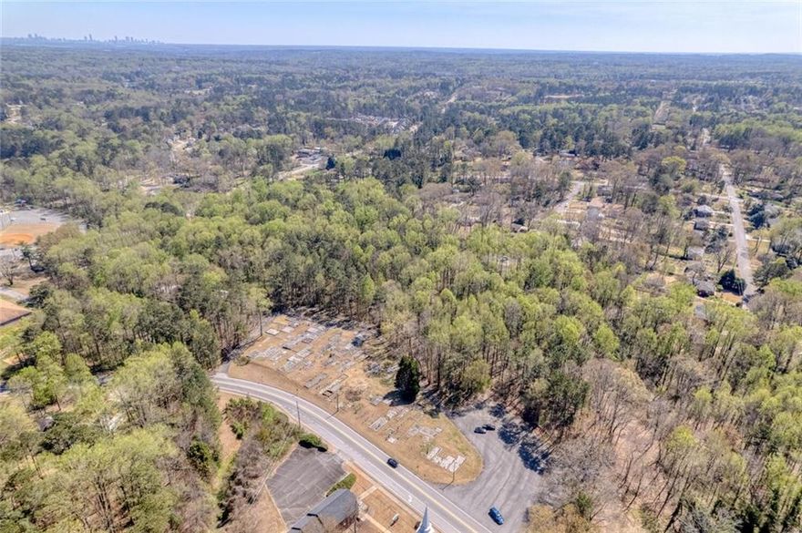 9.5 Total Residential Acres in Marietta Ga, this sale includes 4 lots that total 9.5 acres, lots included are parcel number 19070300580 with 7.1 acres, 959 Old Milford Church Road  Parcel number 19070300310 with 1.1 acres, 929 Old Milford church road parcel number 19070300450 with .50 acres, and 969 Old Milford Church Road parcel number 19070300440 with .80 acres. Property is near the corner of Hicks Road, Smyrna Powder Springs Road and Milford Church Road, across from Milford Baptist Church and walking distance to Birney Elementary School. Electrical Power, Cobb County water service, and Natural Gas from Austell Gas, on site at 959 Old Milford Church and 969 Old Milford church, the 7.12 parcel has a sewer easement on the property. Only 6.9 miles to I-75 and 8 miles to the Braves stadium and The Battery.
Two homes and a barn on the property which could be renovated or torn down. Property is heavily covered with ready to harvest hardwoods and has a creek running through the property in two locations.