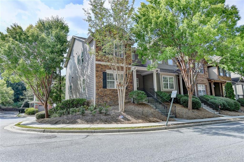 This GORGEOUS 3-story END OF UNIT Townhome is nestled right in the heart of Smyrna. The whole house has been freshly painted with neutral colors. Freshly painted kitchen cabinets and stainless-steel appliances. Newly installed Hardwood floors throughout on main and basement! New Carpet upper! The spacious open floorplan boasts lots of light and French doors that open to a large outside deck. Natural Light and an open floorplan create a great atmosphere for entertaining. Three large bedrooms upstairs, plus an extra finished room in the basement, could be an office, a game room, or a bedroom. Spacious Owner's suite boasts a separate shower and garden tub, a walk-in closet, and a vaulted ceiling. It is a great find with a beautiful poolside community setting. HOA FEES - incl. water/sewer, roof, maintenance, and trash. Quick and easy access to I-285, Vinings, Buckhead, and the Braves Stadium. Meticulously maintained and TRULY MOVE-IN READY!