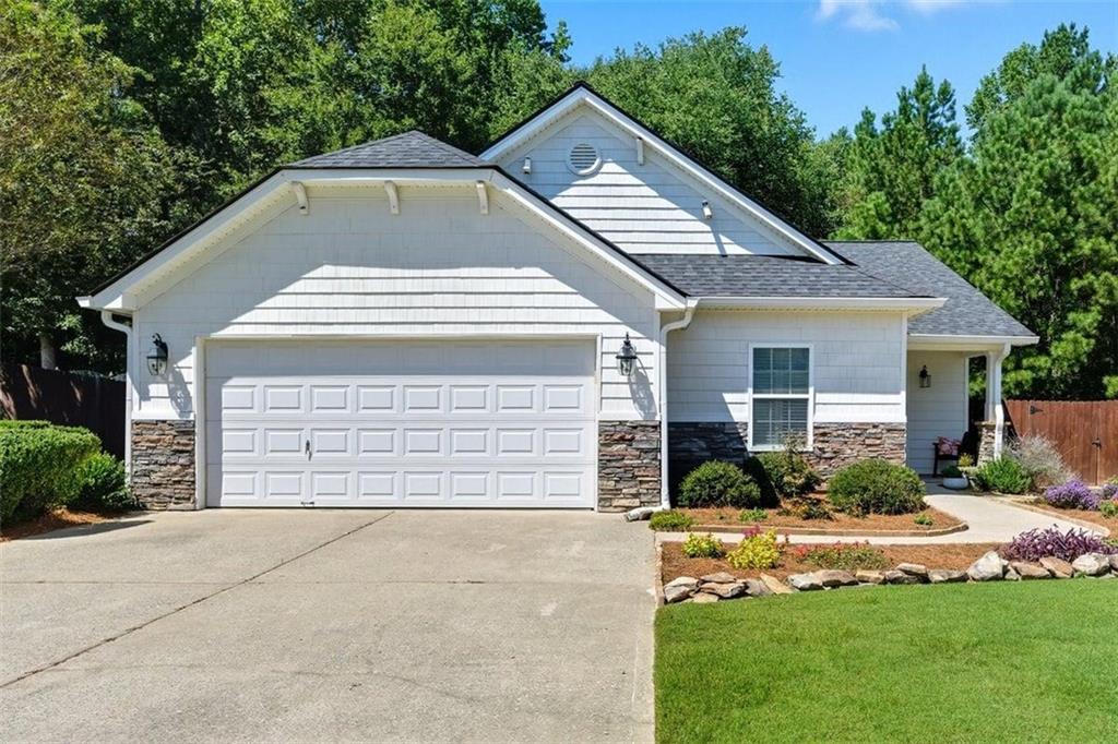 Looking For A Spectacular Ranch That Is Pinterest Perfect? Then This Home Is Calling Your Name! This Charming Home Nestled In The Lovely Dallas, Ga. Has Everything You Want, Combining Style And Comfort In A Way That Just Feels Like Home. As You Step Inside You Will Notice The Bright Open Layout That Makes It Perfect For Both Relaxing And Entertaining. The Living Area Features A Gas Starter Fire Place, Custom Built In Shelving And Stunning Hardwood Floors & Custom Plantation Shutters Throughout Makes This Home A Complete Dream. The Kitchen Features All Black Appliances, Double Oven, Kitchen Island, Pantry & Plenty Of Counter Space. The Primary Suite Offers A Walk In Closet That Is Sure To Impress. The Secondary Rooms Share A Hall Bath And A Separate Laundry Room Makes This Home Complete. The Beautifully Landscaped Front Lawn Sets The Stage For This Home And The Fenced In Backyard Is Your Private Oasis And Your Slice Of Paradise! Come Enjoy The Weather On The Oversized Covered Patio Or Entertain Your Family And Friends With Plenty Of Room For Backyard Barbeques. This Home Is Conveniently Located Close To Nearby Parks, Restaurants, Shopping, Grocery Stores And In An Award Winning School District. Roof Is Only 2 Years Old!! Don't Miss This Opportunity To Own This Beautiful Home!