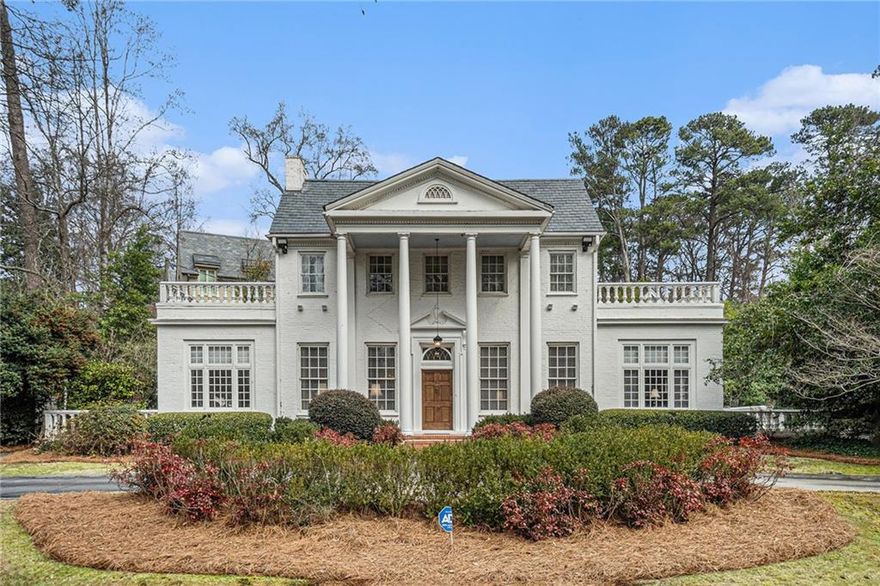 Nestled at the prestigious corner of West Andrews and Austell, this distinguished residence is one of Buckhead’s original homes—a rare opportunity to own a true piece of history. Timeless architectural details abound, from the slate roof and historic custom windows to marble accents and beautifully preserved hardwood floors. A grand foyer opens to a formal living room with a fireplace, flanked by unique spaces—one perfect for a game room, the other a spacious office with built-ins, an attached half bath, and French doors leading to a private patio with a fountain. The formal dining room, seating 12+, flows into a spacious kitchen with a family den, a mudroom with custom cabinetry, and access to a three-car garage. Above the garage, a charming one-bedroom apartment with a kitchenette and full bath offers an ideal guest retreat. The original staircase leads to the primary suite, featuring two walk-in closets, a dressing area, and an oversized bath. Three additional bedrooms and two bathrooms complete the upper level, with two bedrooms offering en-suite access. A second two-car garage with a covered walkway provides extra storage and convenience. With exceptional craftsmanship, historic charm, and limitless potential, this Buckhead landmark is ready to be restored into your dream home.