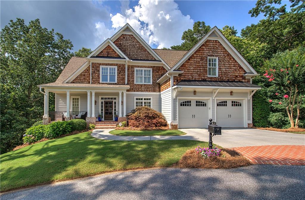 Welcome home to elegant living in the highly desirable, gated community of The Village at Waterside. Nestled at the end of a peaceful cul-de-sac, this home combines grand design with everyday comfort. The community features a sparkling pool and inviting common area—perfect for entertaining friends and neighbors.
Step inside to be greeted by rich hardwood floors and soaring two-story ceilings in the foyer creating a warm and open ambiance. The heart of the home is the spacious family room, complete with a cozy fireplace—ideal for relaxing or gathering with loved ones. Just off the family room, enjoy year-round outdoor living on the screened-in back deck and grilling deck.
The stunning kitchen showcases a large Quartzite island, offering both function and style for the home chef. The main-level primary suite is a private retreat, featuring a double tray ceiling and a spa-inspired bathroom with a large double vanity, a tiled shower, and a luxurious tiled tub. An additional bedroom, full bath, and large laundry room round out the main level.
Upstairs, you'll find a cozy sitting area, two more spacious bedrooms, and a full bathroom. The finished basement adds even more versatility, with a game room, den, workout space, full bath with a steam shower, and ample storage—plus addition deck for outdoor entertaining.
This home is as inviting as it is impressive. Come experience everything the house has to offer—you won’t want to leave.