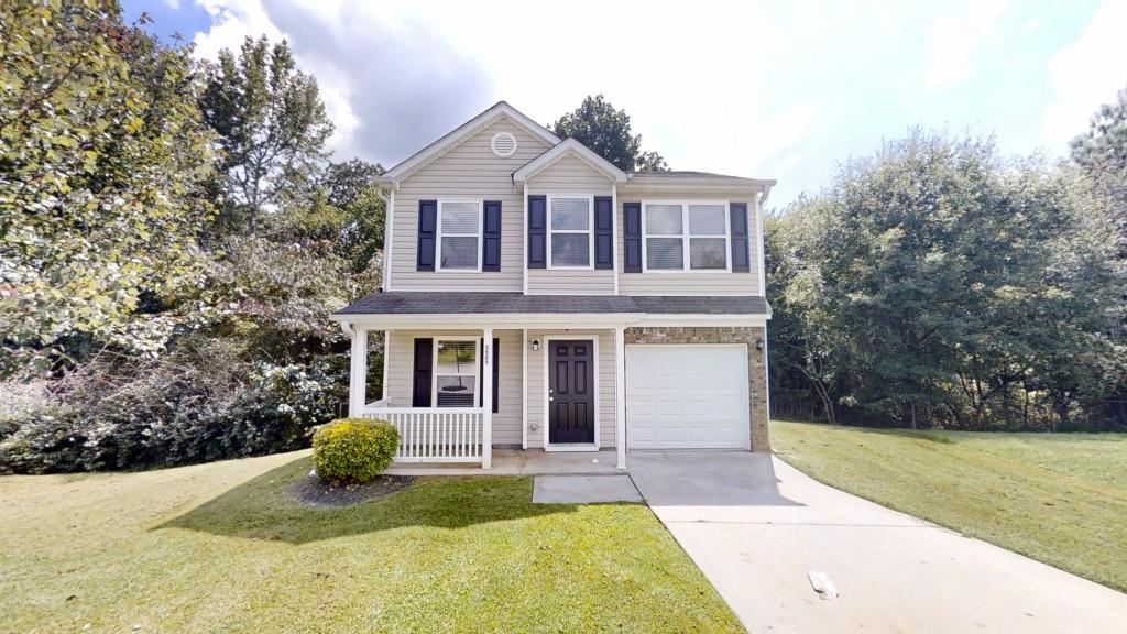 Welcome home!! This well-maintained 3 bedroom, 2.5 bath home in Brookstone is move-in ready! Fresh paint throughout gives the home a bright, updated feel. The main level features easy-care tile flooring in all living and wet areas, while plush carpet adds comfort upstairs. Enjoy a cozy family room with a gas log fireplace perfect for relaxing evenings. The kitchen offers white cabinetry, stone countertops, and stainless steel appliances, making it both stylish and functional. The spacious primary suite features a large bedroom and en suite bath, offering a comfortable retreat. Step outside to a rear deck, ideal for entertaining or enjoying quiet evenings outdoors. Located just minutes from shopping, dining, and quick access to I-85, this home offers the perfect blend of comfort and convenience.