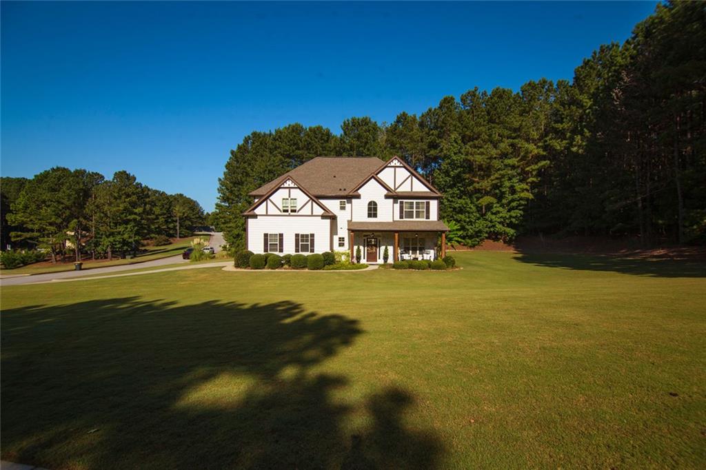 Updated 4/2.5 house on large professionally landscaped yard. The list of improvements and upgrades can easily be seen from the photos but what you may not see is newer roof and newer HVAC system to name a few. The eat in kitchen provides great work space with Island and Stone Counters which opens to the GR. The GR has a fireplace and accent wall with room for a large sectional. This leads to a large screened porch with room for a sitting area and dining area. The DR provides a large space for a formal diner and features wainscoting. The LR/ FR is another generous sized space that features a shiplap wall. Upstairs you will find the light an airy owners retreat that is very large. Features include double tray ceiling, sitting room, ceiling fan and four windows to allow for plenty of light. The master bath is also large and features the level of finish one would expect. These include large walk in closest, double vanity, jetted garden tub, private shower, water closest and a second storage closest. Each of the other 3 Bedrooms are of good size and can fit a queen size bed, have large closest and ceiling fans. The laundry room is also on the second floor. Outside you will find a professionally landscaped sodded yard. The outdoor fire pit is tucked away on the edge of the woods, has lights and is perfect for family time. There is also a private zen-like area to put the hammock in the wooded area of the yard. If throwing a ball or frisbee is what you need you have the space.