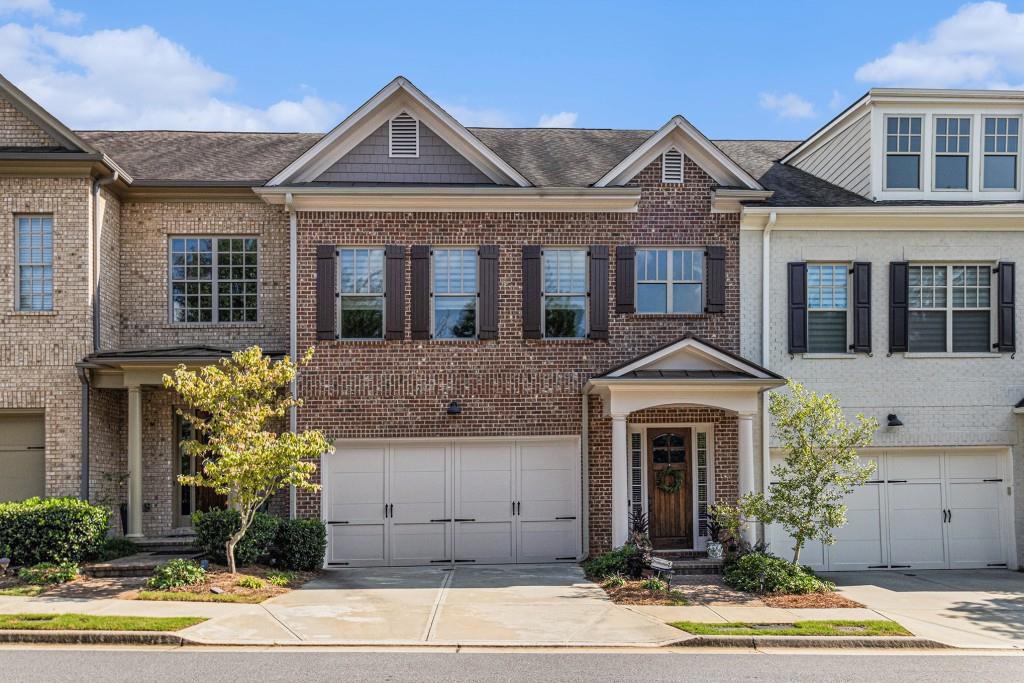 Stunning Townhome in the Exclusive Gated Community of Duke Reserve! Tucked within a private enclave of just 25 homes, this residence offers the perfect combination of sophistication, space, and convenience. Ideally situated minutes from Peachtree Corners Town Center, The Forum, and top-rated schools including Wesleyan and Cornerstone Christian, you'll also enjoy effortless commuting with quick access to Holcomb Bridge for Roswell, Spalding for Dunwoody, and 141 to I-285. Step inside to an Open Main Floorplan with soaring ceilings and rich Dark Hardwood Floors that flow throughout. A front Sitting Room offers versatile use as a Home Office, Library, or Study. The central Living Space boasts a Fireside Family Room with Built-Ins and easy access to the Private Fenced Patio, perfect for entertaining or relaxing. The Bright White Kitchen features Stainless Steel Appliances, a Custom Tile Backsplash, and a Large Island with Breakfast Bar, while the adjacent Breakfast Nook offers abundant storage and charm. A separate Dining Room, convenient Half Bath, and Mudroom complete the main level. Upstairs, a cozy Landing Nook makes an ideal Playroom, Office, or Media Space. The Oversized Owner's Suite impresses with a Spa-Style Ensuite featuring Dual Vanities and an Oversized Tiled Shower with Bench, along with an Expansive Custom Closet. Two additional Bedrooms share a Hall Bath, providing plenty of space for family or guests. For added peace of mind, this home is equipped with a Security System, Fire Sprinkler System, Smoke and Carbon Monoxide Detectors, and a Door Camera. Enjoy a low-maintenance lifestyle with all the benefits of a private, gated community this exceptional townhome truly delivers comfort, elegance, and location in one!