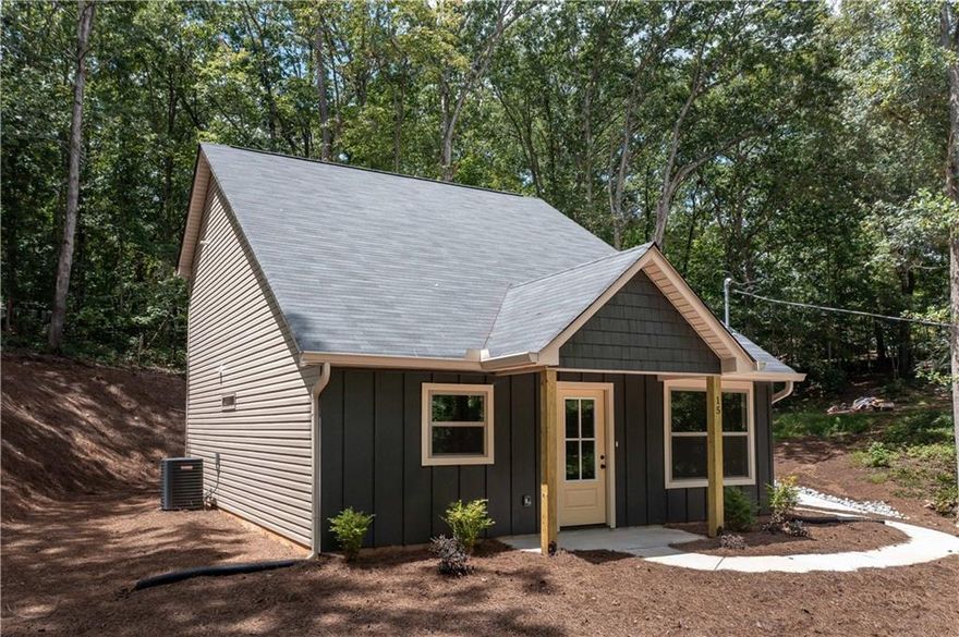 Breathtaking New Construction! This charming Craftsman-style home offers 3 bedrooms and 2 full bathrooms. Step inside to a warm, inviting living room that flows into a quaint kitchen featuring granite countertops, stainless steel appliances, and gleaming hardwood floors throughout. The main-floor primary suite boasts a spacious walk-in closet and a beautifully tiled shower with a double vanity. Upstairs, two additional bedrooms adjacent from the hall bathroom with a double vanity, perfect for family or guests. Don't wait-this one's hot on the market! Have your Realtor call today!