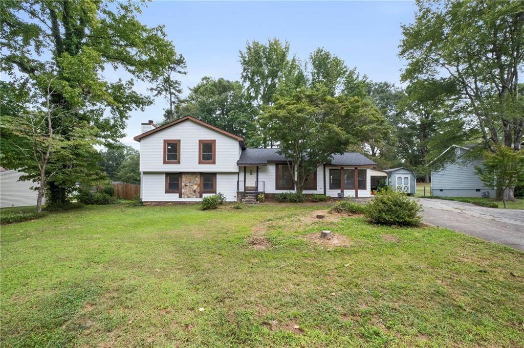 Charming 4 bedroom home in the sought-after Sandy Plains Estates neighborhood! This bright, open-concept home has been completely renovated with thoughtful updates throughout. Enjoy peace of mind with a new roof, new HVAC, and new water heater. The stunning kitchen features all-new stainless steel appliances, granite countertops, and a spacious island perfect for meal prep or casual dining.
Freshly painted inside and out, the home also offers updated bathrooms, new flooring, modern lighting, and an oversized master suite with a beautifully appointed bath. A cozy fireplace anchors the inviting family room, while the deck overlooks the fenced backyard—ideal for relaxing in your own private retreat.
The finished basement comes complete with a full bedroom, full bathroom, and exterior entrance. Conveniently located just minutes from I-75, I-575, Marietta Square, shopping, and local dining, all in the highly regarded Sprayberry High School district. Best of all—No HOA!
?? Listing agent is also the property owner.