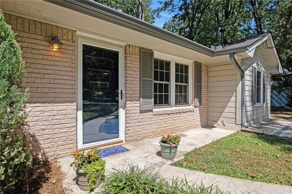 A Rare Jewel situated in a quiet, established Parkview neighborhood within walking distance to the Quaint Village of Downtown Lilburn. This adorable Classic Ranch-style home has been lovingly remodeled to create a fabulous comfortable living space featuring an open kitchen with a cozy breakfast nook, dining area and family room filled with natural light. The 3 spacious bedrooms are accented by the timeless warmth and beauty of the original hardwood floors. The large laundry room also provides ample storage space. Enjoy evenings on the back patio overlooking the large private backyard that provides endless opportunities for gardening, outdoor entertaining or future expansions. All this just a short distance to Downtown Lilburn where you can enjoy restaurants, shopping, a fabulous park with playground, walking/biking trails and year-round outdoor entertainment events. New roof, new electrical wiring, sought after Parkview schools and conveniently located for easy commuting...what more could you want!