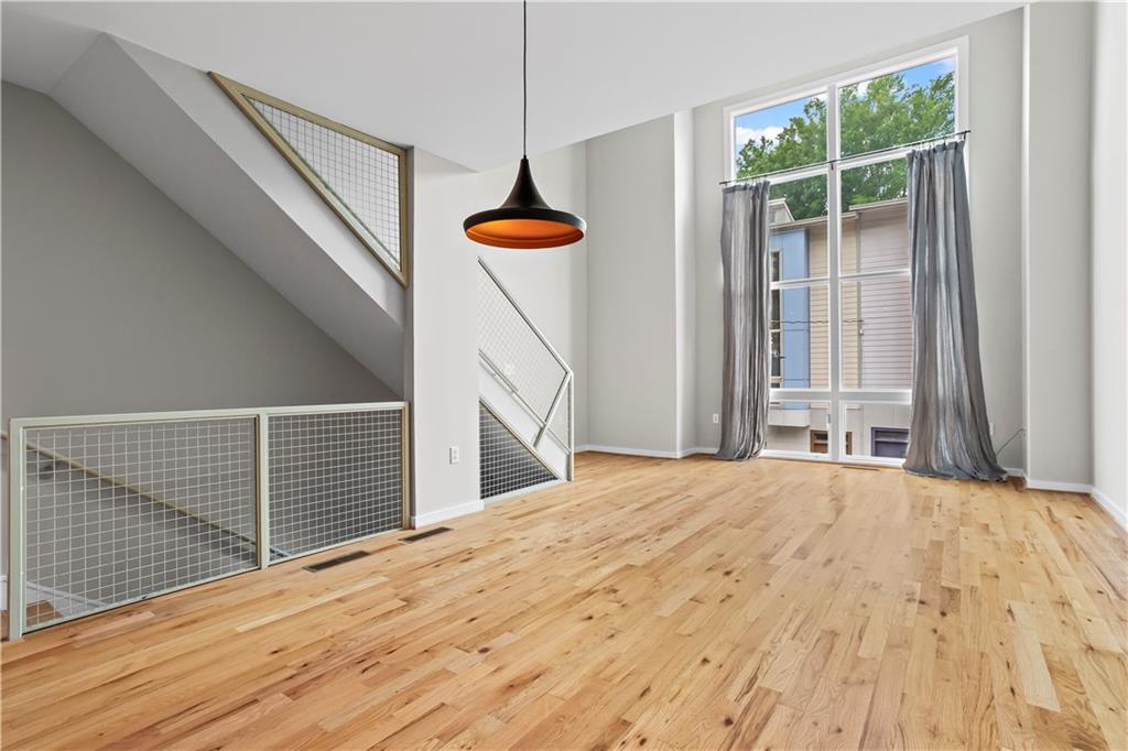***Assumable mortgage rate available at a 3.15% interest rate!!!***
Welcome to your new home in the heart of West Midtown’s highly desirable M West community, offering direct access to the Atlanta Beltline and unbeatable walkability to the area’s hottest spots. Stroll to The Works, Dr. Scofflaw’s Brewing, Bone Garden Cantina, and more, all just minutes from your front door.
This contemporary 3-story townhome features an open and airy layout with soaring 20-foot ceilings and dramatic floor-to-ceiling Pella windows that flood the space with natural light. The second-floor main living area is perfect for entertaining, with a sleek kitchen featuring stainless steel appliances, granite countertops, and a custom pantry with ample storage.
Upstairs, the top-level primary suite offers treetop views thanks to neighboring units being only two stories tall. Enjoy a spacious walk-in closet, a laundry room with built-in cabinetry, and an ensuite bath with a soaking tub and separate shower, your own private retreat.
The entry-level features a 2-car tandem garage with generous storage and a rear door that opens to a private, fenced-in backyard with both a patio and deck, ideal for outdoor entertaining or relaxing with your pets.
Freshly painted in May 2025, this home also boasts gleaming newer hardwood floors, an upgraded HVAC system, and newer washer and dryer, making it truly move-in ready. With few 1-bedroom units in M West, this home is a rare and affordable opportunity in one of Atlanta’s most vibrant communities.
Residents also enjoy top-tier amenities including a newly refinished saltwater pool, dog park, and a fully equipped fitness center.
***Assumable mortgage rate available at a 3.15% interest rate!!!***