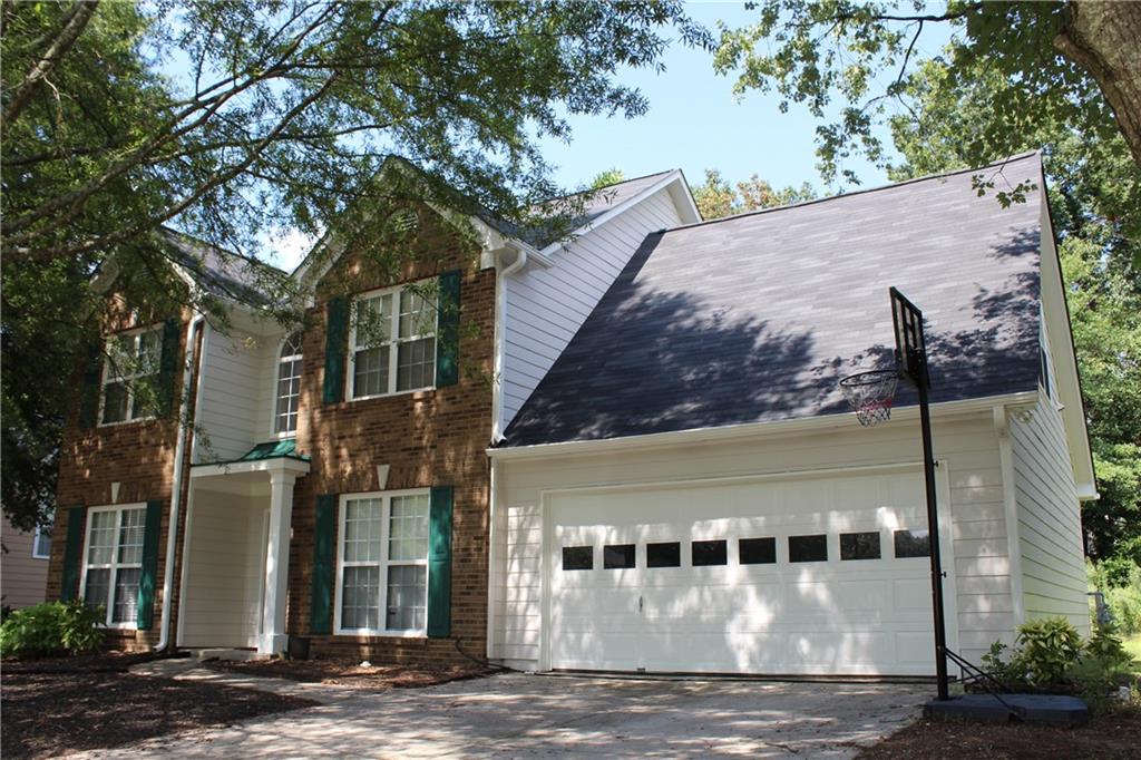 Welcome Home! Located in the wonderful neighborhood of North River Colony in a well-established community. This delightful home offers 4 bedrooms, 2.5 bathrooms, providing ample space for enjoyable living. The main floor features all newer carpet in family room, a separate formal living room and dining room. On the right side of the home, you will find a separate dining room that leads into a spacious kitchen with white cabinets, gas stove, and stainless-steel appliances. Open floor plan with large kitchen bar with view of breakfast room and family room with fireplace. The half bath on the right side of the kitchen area and a spacious laundry room. Upstairs features a large primary owner’s suite with a spacious bathroom showcasing double vanities, a walk-in shower, vaulted ceiling, large garden tub, and a walk-in closet. On the other side of the staircase, you will find two bedrooms, a full bathroom, and a generously sized bedroom down the hallway. Step outside to the patio, where you can unwind and enjoy the fresh air while overlooking the trees. With plenty of space for entertainment, play, garden or simply relax. Upgrades include new carpet in family room, exterior painting with repairs, new roof, newer garage door, new flooring and toilet in hall bath, and new HVAC system. All the important updates have been made! Award winning Gwinnett County Schools, conveniently located near grocery stores, local restaurants, community parks, shopping and the Mall of Georgia. This is a great opportunity to make this your dream home! Come today! This won’t last long on the market!