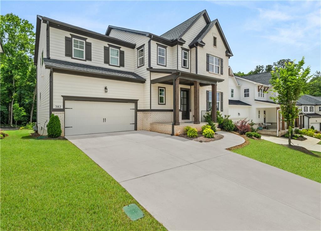 North-Facing 5 Bed / 4 Bath Toll Brothers Home | Hillside Plan | Unfinished Basement.
Beautifully crafted Toll Brothers home on an 8,712 sq ft lot with 3,511 sq ft of living space plus a 1,600 sq ft unfinished basement. Features include a grand 2-story foyer, open-concept layout, upgraded hardwood flooring, premium Level 7 carpet on stairs and all bedrooms,formal dining, and a great room with fireplace.The gourmet kitchen boasts a large quartz island, soft-close cabinets, stainless steel appliances, butler’s pantry, and a walk-in pantry. Main-level bedroom and full bath are perfect for guests or an in-law suite. Upstairs you'll find a spacious loft, oversized owner’s suite with a luxurious bath and walk-in closet, plus three more bedrooms, two full baths, and a large laundry room.
Enjoy 10 ft ceilings throughout, covered front porch with cedar columns, and a private covered rear patio with wooded views. Community amenities include a pool, dog park, walking trails, and game courts. Top-rated schools, minutes from Publix, Walmart, and Downtown Woodstock.