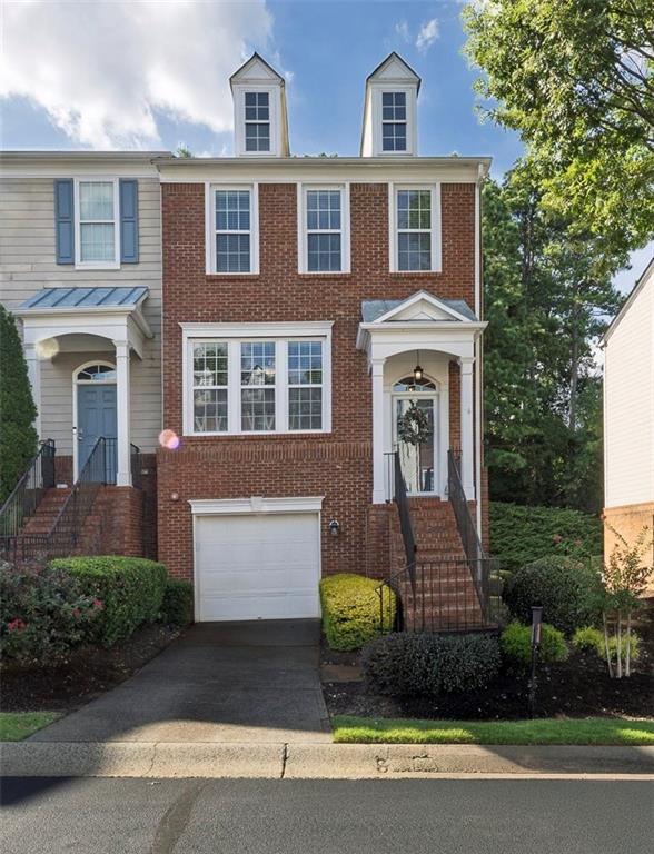 This beautiful end-unit townhome is located in the highly sought-after master-planned community, Woodlands. From the moment you enter the inviting foyer, it is clear that this home has been lovingly maintained. The main level boasts a light-filled family room with a cozy fireplace, a spacious kitchen with a center island offering seating, abundant cabinet and counter space, newer appliances, and a generous walk-in pantry that flows seamlessly into the dining area. Step outside to the private rear deck, complete with lights, where you can enjoy peaceful views of the wooded surroundings. A convenient half bath for guests completes this level. Upstairs, the primary suite offers a vaulted ceiling, a walk-in closet, and an ensuite bath with a double vanity. An additional bedroom and full bathroom are also located on this level, along with a conveniently placed laundry area between the bedrooms. The lower level offers a versatile bedroom that can easily serve as flex space, with direct access to the backyard and its own full bathroom. The garage includes a storage nook, providing extra space for organization. Residents of the Woodlands enjoy resort-style amenities, including two pools, ten tennis courts, pickleball, an expansive playground, basketball courts, sand volleyball, a clubhouse for gatherings, and miles of nature trails throughout the community, with future plans to connect to the new Little River Park nearby. The neighborhood hosts a variety of events throughout the year and is located within an award-winning school district. The location is ideal, with direct access to Hwy 92 for a quick drive to Downtown Woodstock’s shopping, dining, and entertainment, or an easy trip into Roswell and East Cobb for even more options. Commuters will also appreciate the close proximity to I-575. Come experience why Woodlands is one of the most desirable communities in the area and discover the lifestyle you’ve been looking for. Please refer to the features sheet online for additional information regarding this beautiful property.