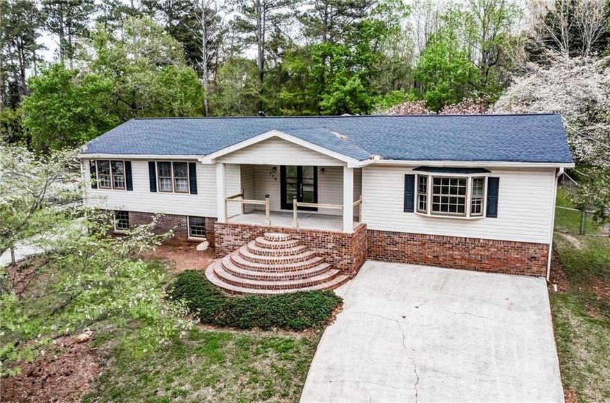 Settle in to this charming, recently renovated ranch in the Harrison High School district.  3 bed, 2 bath, full basement, LVP in the den, kitchen, dining room and hall.  White kitchen cabinets and granite countertops, lots of counterspace, electric range/oven, refrigerator, dishwasher, washer/dryer.  Kitchen opens to the dining room with a breakfast nook, ideal for gathering and entertaining company, den with a charming painted fireplace, enclosed sunroom in the rear, the perfect reading nook, looking out at your own private fenced in back yard, amongst the azaleas and pine trees, it's great for cookouts and growing a small tomato garden.  3 bedrooms, 2 bath.  For all hobbyists, this house features a full basement with exterior access, a spacious detached garage with work benches.  On septic.  Fireplace not operable.  Minimum credit requirements: No evictions in previous 7 years, no substantial amount of delinquent accounts, collections, charge-offs. No bankruptcies in previous 7 years. Income to rent ratio of 3 to 1 ($90,000 per annum net of COMBINED household income), substantiated by documents that applicant can upload to the application portal, no smoking (inside only). Application fee of $60, one application per adult.  Text or email me for a link to our online tenant application, tour dates, and any questions you may have.