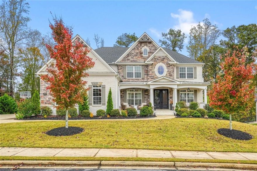 Welcome to 6425 Westbay Terrace in Cumming's prestigious Westfall community-an exceptional residence that blends luxury, comfort, and truly elegant design.  Step inside to discover an open and airy floor plan with high ceilings and abundant windows that flood the home with natural light. The two-story family room is the heart of the home, designed for both everyday life and entertaining.  The chef's kitchen is elegantly appointed-with ample counter space, a center island (perfect for prepping or gathering), and high-end finishes throughout. Whether you're hosting dinner or enjoying a casual morning coffee, this space is built for flexibility.  The master suite is a true retreat: generous in size, with an en-suite bath, walk-in closet, fireplace, sitting area, and views that open to the backyard. Four additional bedrooms, each with its own private en-suite, provides excellent space for family or guests, and one could easily serve as a bonus room.  Situated on a lush half-acre plus lot, the property offers a roomy yard for outdoor living, recreation, and relaxation. With mature landscaping and privacy from neighboring homes, the setting is both tranquil and functional.  The community of Westfall adds lifestyle value, easy access to 400, and is within reach of top-rated schools.