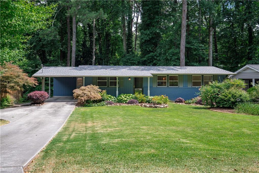 Beautiful Move-In Ready Home in the Prime Location of Doraville, Inside the Perimeter. SPACIOUS & UPDATED 4 BDRMS ,3 FULL BTHRMS, * 2 KITCHENS, Freshly Painted, Refinished Floors, New Roof.  BEAUTIFUL SURROUNDINGS: Large Leveled Lot, Exquisite Gardening Throughout the Property that Will Move You Year Around. Don’t Miss the Majestic Private Backyard Creek and Landscape. You Might Forget You Are in the City and Think You Are in the Mountains! FUNCTIONAL LAYOUT: Enjoy the Open-Concept Floor-Plan with a Charming Kitchen with Brand New Appliances and the deck Overlooking the Mesmerizing Backyard. ***BONUS IN-LAW SUITE or RENTAL UNIT with Separate Entry from Main Living Area. Imagine the Possibilities with a Whole Different Living Area. GREAT LOCATION, LOCATION, LOCATION! Walking Distance to MARTA, Close to Buford HWY, Restaurants, Grocery Stores, Schools, Parks, Playground, Community Garden, Movie Studios and So Much More! Not Only Does This Home Have So Much, the Area too Has So Much To Offer As Well!
