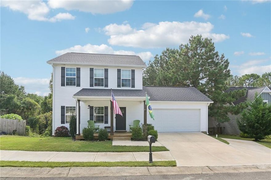 Gorgeous Home Near Historic Downtown Ball Ground! Just a mile from shops and dining, this home offers bright, inviting spaces with plenty of charm. A classic Southern-style front porch welcomes you inside to beautiful, low-maintenance laminate wood floors that flow throughout the main level living areas. The living room is light-filled, while the on-trend kitchen features granite countertops, a tile backsplash, large island with seating, apron-front farm sink, and pantry. A sunny breakfast room overlooks the private wooded backyard. A laundry room and half bath complete the main floor. Upstairs, the primary suite is a true retreat with dual sinks, granite counters, a walk-in shower, and spacious walk-in closet. Two additional bedrooms and a full bath ensure room for everyone! The newly finished basement is a fantastic bonus, offering a large multipurpose room—perfect for a media room, home office, or playroom—plus a bedroom and full bath. Enjoy outdoor living in the private backyard, complete with a large deck for grilling and entertaining, all surrounded by mature trees. With its prime location less than a mile from historic downtown Ball Ground, this home combines modern comfort with small-town charm. Book your tour today!