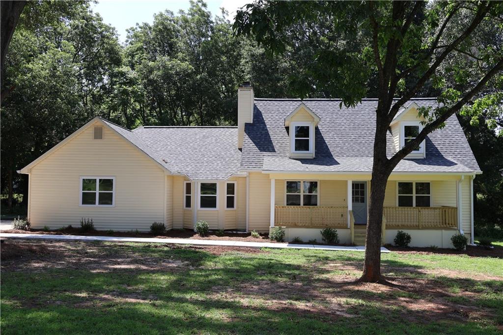 Freshly renovated two-story Cape-Cod with Owner's Suite on Main on a quiet Peachtree Farms cul-de-sac. - Up to $10K in Down Payment Assistance! 2025 improvements include new roof, kitchen, bathrooms, dual HVACs, water heater, front porch, rear deck, lighting, and plumbing fixtures. Bright quartz kitchen with stainless range, microwave, and dishwasher opens to dining area and fireside family room. Owner’s suite on the main level; two huge bedrooms and full bath upstairs. Refinished original hardwoods on the main floor, and new carpet upstairs. Level yard with new walkway and room to play or garden, plus plenty of driveway parking. No HOA rules to worry about. Just 5 min to East Clayton ES, Adamson MS, Reynolds Nature Preserve, and I-675 for an easy airport/Atlanta commute. Move in and enjoy the work that’s already been done! Financing Incentives: Eligible buyers may qualify for up to $10,000 in Down Payment Assistance and 100% financing with no PMI.