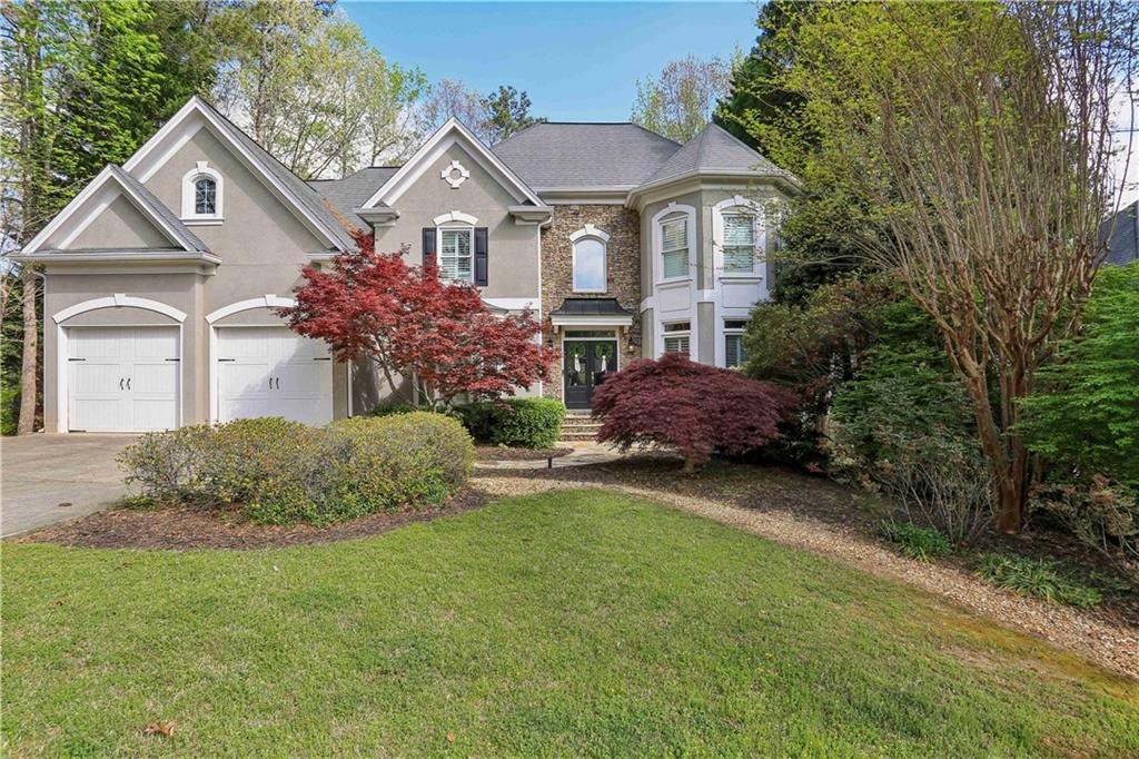 Lakefront living in gorgeous East Cobb Edgemere Estates! Walk into a spacious 2 story entry with view to the Dining room and Family room. The open floor plan has hardwood floors and an abundance of natural light allowing for easy entertaining! The stunning kitchen with updated white cabinets and stone countertops hosts a new refrigerator, gas cook top, stainless steel appliances, and wet bar overlooking the breakfast room and 2 story family room. The main level also hosts a bedroom and full bath. Relax on the screen porch off the kitchen. Upstairs retreat to the spacious primary suite with tray ceilings, his and her closets, and an oversized bath with separate soaking tub and spa-like shower. Two additional secondary bedrooms on the second level have en suite bathrooms. The laundry with a new washer and dryer that remain with the house are also located on the 2nd level. The terrace level has another family room, game room, additional bedroom and bathroom. With multiple outside spaces, this house has beautiful views overlooking the lake. Bring your canoe and enjoy rowing or fishing in the catch and release lake! An active community with amenities including a pool, tennis and playground are steps from the house. 3 new HVAC systems and a new water heater, a Buyer’s dream!