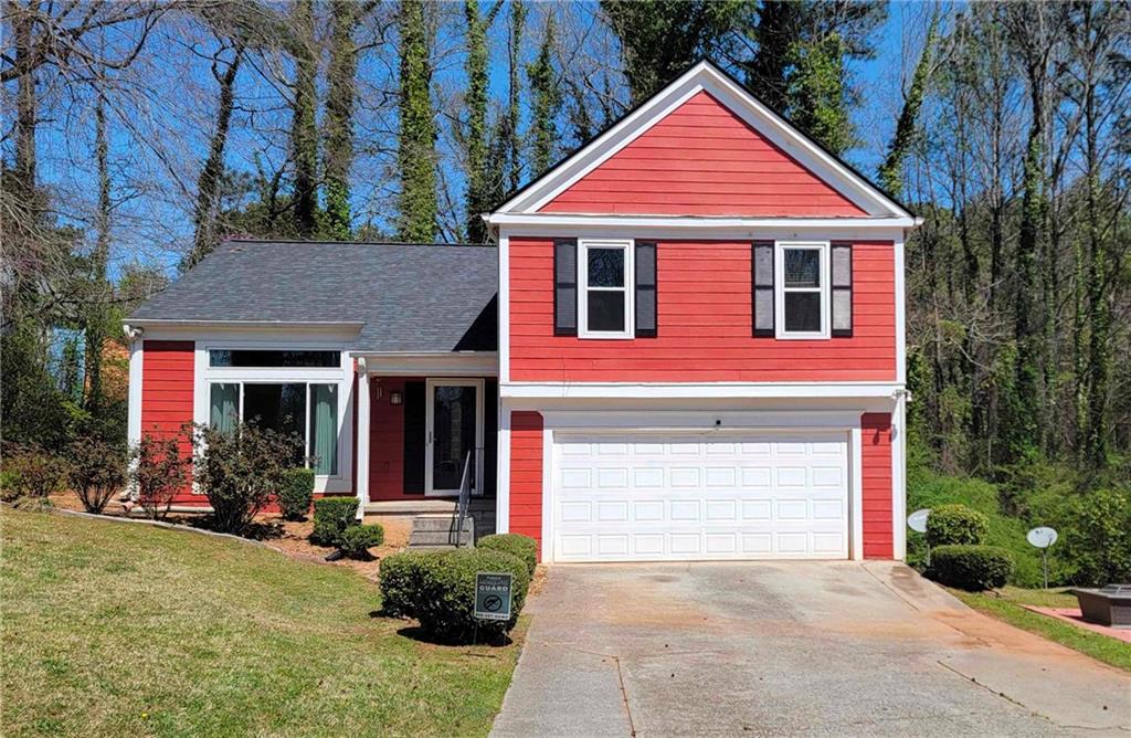 Charming Split-Level Retreat in Lithonia - Move-In Ready! Welcome to 7472 Woods Court - a beautifully maintained 3-bedroom, 2.5-bathroom home tucked away in a peaceful cul-de-sac within a well-established Lithonia neighborhood. This spacious split-level residence is perfect for families or first-time homebuyers seeking comfort, convenience, and style. Step inside to an inviting, open-concept layout featuring a bright family room with a cozy fireplace-ideal for relaxing evenings. The adjacent dining area flows effortlessly into a well-appointed kitchen with stainless steel appliances, a new dishwasher, electric stove, state-of-the-art microwave, and ample cabinet space. The expansive master suite is a true retreat, offering a large walk-in closet and an en-suite bath with double vanities. Two additional bedrooms share a stylish and functional full bath. Recent upgrades include: * New roof and gutters (under 2 years old) * Updated HVAC, furnace, and water heater (approximately 2 years old) * Custom energy-efficient windows (less than 10 years old) * Freshly painted interior and exterior * Brand new carpet, hardwood, and ceramic tile flooring Enjoy the outdoors in your private, wooded backyard with a deck-perfect for entertaining or simply relaxing in a tranquil setting. The two-car garage and long driveway provide plenty of parking and extra storage space. Located minutes from schools, parks, shopping, and dining, this home truly has it all. Seller will consider lease purchase offers. Don't miss your chance to own this wonderful home-schedule your showing today and experience the best of Lithonia living!