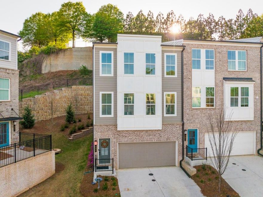 A Unicorn in the neighborhood: Built two years ago, this lovely home is almost 600 square feet bigger than most units! Corner unit with 21 windows and custom blinds, making it light, bright and airy. A true terrace level with private patio, a half bath and walk-in closet unlike the newer builds where the ground level feels like a basement. Large 2 car garage and driveway! Extra long kitchen island that is double the width of most other units. High end appliances are included too!  These are just a few of the unique features that make this a spectacular investment, and more importantly, a great big new adventure in living. The gourmet kitchen steals the show with quartz counters, high-end appliances, and an extra-wide island that doubles your entertaining space. Flow seamlessly through the airy dining and living areas or step out to your private deck for brunch, cocktails, or BBQs.  Upstairs, unwind in a spa-inspired owner's suite with soaking tub, walk-in shower, and dual closets. Two additional bedrooms offer flexible space for guests or creative pursuits.   The versatile terrace-level bonus room offers flexibility for a guest suite, fitness studio, home office, or media lounge. A two-car garage with 220 volt charging keeps life easy and future-ready.  Best of all, your lifestyle is amplified by location: minutes from Grant Park, The Beacon, Summer Hill and all the best of Atlanta. And to top it all off, it is steps from the new addition to the Beltline. This is the ultimate blend of modern sophistication, hip city living, and a peaceful retreat to call your own.  Live Bold. Relax Deep. Love Living. Especially here.  Come on home to HAPPY today!