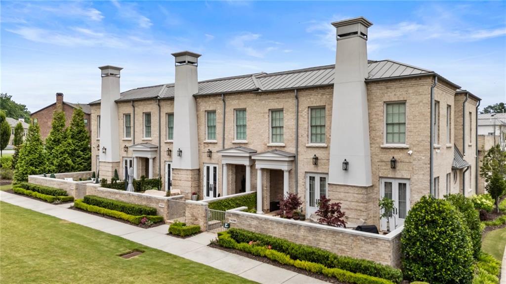 Custom European-Style End Unit Estate Townhome in Avalon – Alpharetta’s Premier Mixed-Use Community!
Welcome to an exceptional opportunity to own one of Avalon’s most sought-after and popular floorplans — a custom-designed, two-story estate townhome situated in the heart of Metro Atlanta’s most vibrant mixed-use community. This coveted end unit location offers enhanced privacy, with only one shared wall, and an abundance of natural light that fills every space.
Ideally positioned in Alpharetta, this residence offers unrivaled convenience with easy access to GA-400, the Alpha Loop, and charming downtown Alpharetta — all just moments away. But life at Avalon is more than a home — it’s a lifestyle. Enjoy the ease of resort-style amenities, world-class shopping, top-rated restaurants, and year-round entertainment events just steps from your door. Private community features such as a sparkling pool, and inviting gathering spaces create an elevated, low-maintenance living experience you will absolutely love.
This like-new, all-brick estate townhome is a rare offering, showcasing nearly 3,700 square feet of thoughtfully designed living space, an impressive 30-foot wide floorplan, 10' high ceilings, and a spacious 3-car garage. The flexible layout includes 4 bedrooms and 3.5 baths, featuring both a primary owner’s suite on the main level and a second owner’s suite upstairs — ideal for guests or multi-generational living. Both suites offer generous walk-in closets for exceptional storage.
Luxurious details are found throughout: rich engineered white oak flooring on both levels, a chef’s kitchen with top-tier appliances and timeless designer finishes, and a gated front courtyard that creates a peaceful retreat perfect for outdoor entertaining or relaxing.
The entire home has been professionally repainted with high-quality eggshell finish — an expensive upgrade that not only provides a beautiful soft sheen but also allows every wall to be easily cleaned and maintained, preserving the fresh, new feel of the space. To further elevate the home, all-new designer lighting fixtures have been installed, perfectly complementing the modern yet classic aesthetic.
For the tech-savvy homeowner, a fully integrated Control4 home automation system manages audio, video, and smart home features seamlessly throughout the residence.
Every detail — from the expansive, sunlit layout to the premium finishes — reflects superior craftsmanship and thoughtful design, making this residence both sophisticated and exceptionally livable.
If you desire the perfect blend of location, luxury, and effortless lifestyle, this Avalon end-unit townhome stands unmatched — offering the finest in upscale Alpharetta living.