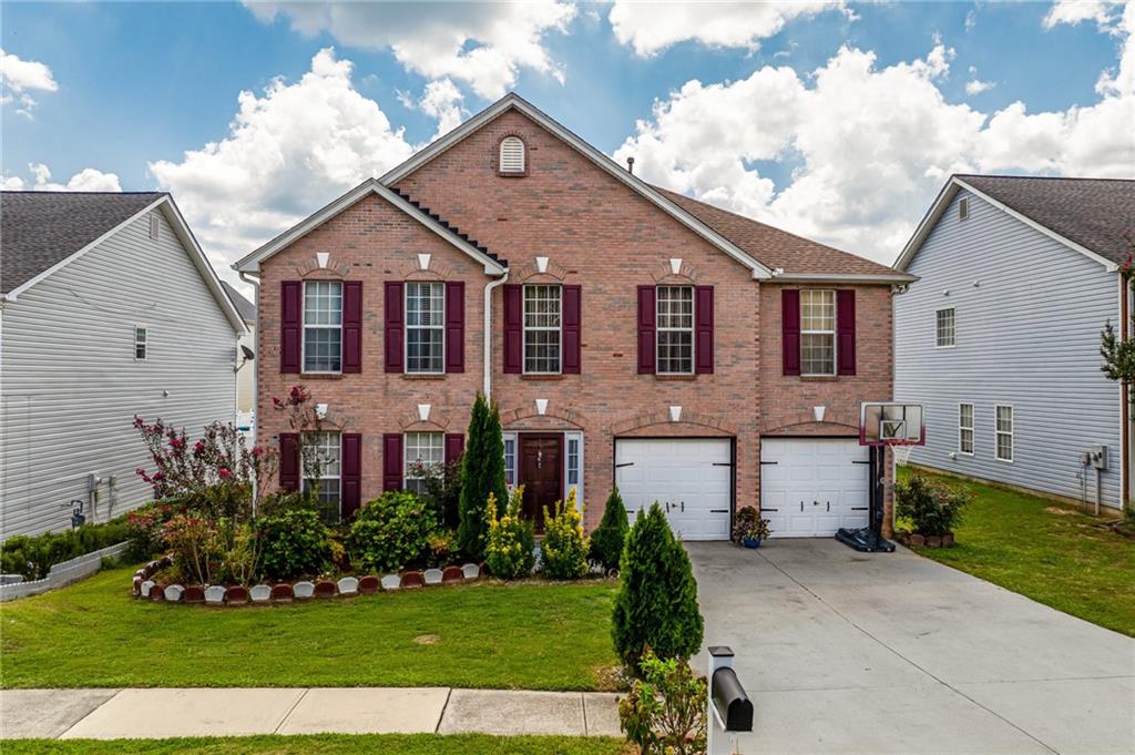 Welcome to this stunning two-story home in the sought-after Preserve at Parkwood. The inviting brick fa ade, manicured landscaping, new HVAC and a roof less than three years old set the tone for the well-maintained interior. Step inside to find gleaming hardwood floors that flow through the welcoming living room and separate dining area. The open-concept kitchen and great room provide the perfect space for entertaining, complete with upgraded appliances, generous counter space, and a convenient powder room for guests. Upstairs, discover five spacious bedrooms, including a luxurious primary suite with a private en-suite bath. The fenced backyard offers plenty of space for gardening, play, or outdoor gatherings. Located in a friendly community with sidewalks, streetlights, and a low HOA, this home is close to shopping, dining, and all the conveniences of Snellville living.
