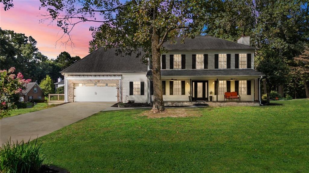 WELCOME TO A BEAUTIFUL SOUGHT AFTER WESTGATE CORNER LOT HOME! Welcome! Enjoy your very own rocking chair front porch with great curb appeal. This is the perfect place to enjoy your morning coffee! This home hosts space for family gatherings and more! Gorgeous hardwood floors and tons of updates throughout! This home features a Double Master. One Master on the Main level and a Second Oversized Master upstairs. The outdoor setting includes new back deck as well as a new side deck off the garage. Inside you will also find a massive living room filled with natural light, views to the private back yard as well as views of the fountain and community lake area located just beyond the backyard. Master on main hosts a fireplace and French doors open onto a large deck overlooking your private backyard and perfect outdoor oasis! . The second Master is located on the second floor. Here, you will find large windows that fill the room with natural light, a sitting area, a renovated owner's bath complete with a large walk-in shower, dual vanities, his and hers closets, and tons of extras! The secondary bedrooms are generously-sized with large closets. New septic field lines installed with warranty transfers to new owners. This beautiful home is perfectly perched upon an oversized, corner lot and conveniently located minutes from I-75, shopping, restaurants, and more! This amazing home won't disappoint. Call today, don't let this one get away!