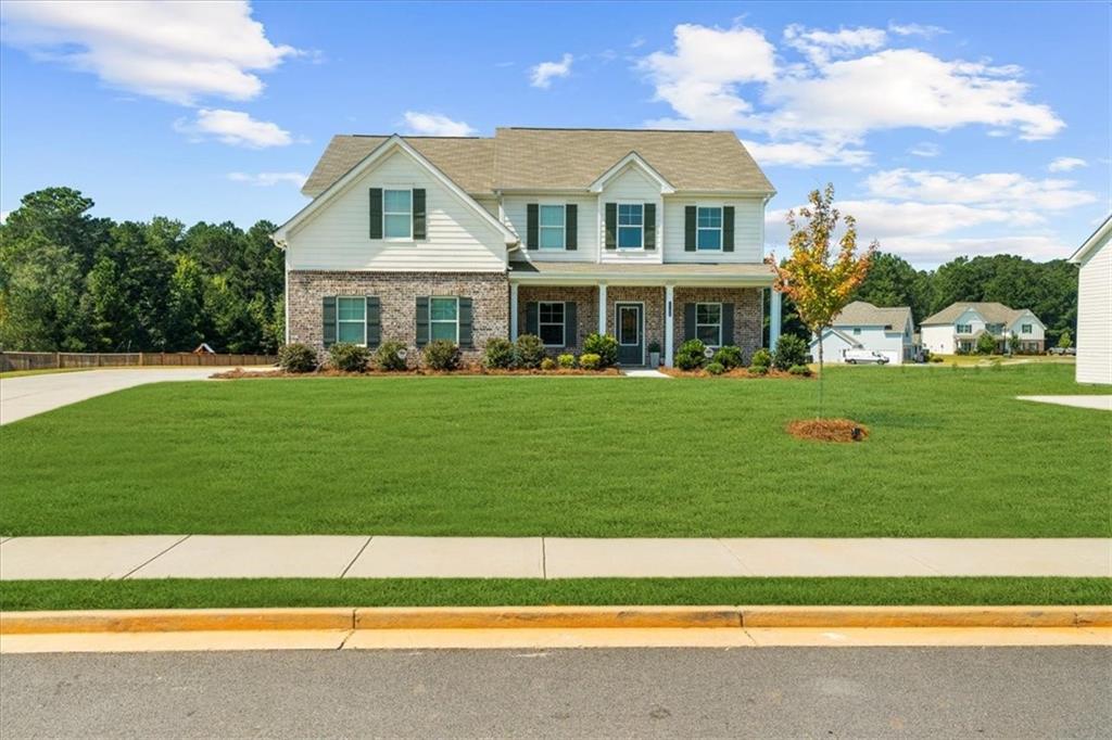 Beautiful 5-bedroom, 3-bath home in Monroe, GA! This like-new home offers a full bedroom and bath on the main level, luxury laminate flooring throughout, and a spacious office perfect for remote work. Upstairs, you'll find the primary suite with a private bath, plus 3 additional bedrooms and another full bath. The large backyard offers plenty of space for outdoor fun. A perfect family home with room to grow! Sellers are offering a $5,000 credit towards closing cost or buy down!