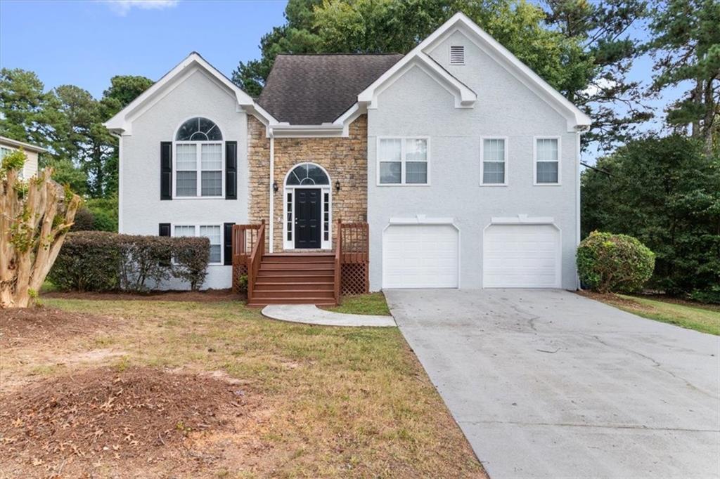 Welcome to Loganville and the highly sought-after Archer School District! This beautiful 4-bedroom, 3-bath split-level home offers all the space your family needs. The upper level features an open floor plan with a family and dining room combination, an eat-in kitchen with stainless steel appliances, and access to a spacious deck overlooking a flat backyard—perfect for entertaining. The master suite boasts double vanities, a separate shower and tub, and a walk-in closet, along with two additional bedrooms and a full bath on the same level. The lower level includes a private bedroom with a full bath—ideal for an in-law or teen suite—plus an additional family/media/game room for endless possibilities. Priced to sell, this home is move-in ready and located in one of the area’s top school districts. Don’t miss your chance—schedule your showing today!
