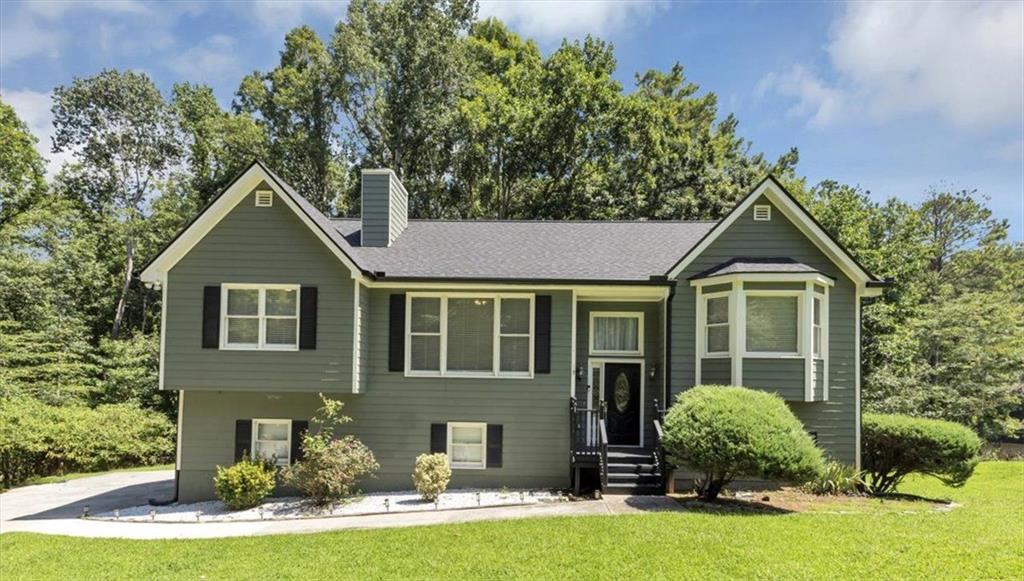 Located in desirable Conyers, this spacious home offers nearly 1,900 sq ft with 4 bedrooms and 3 baths, featuring a stylish kitchen with granite countertops and stainless steel appliances, an architectural accent wall and fireplace in the family room, and vaulted ceilings in the oversized primary suite complete with a bay window, large walk-in closet, and a luxurious bath boasting a soaking tub, separate shower, and dual vanities. The versatile layout includes a guest bedroom and bath, a Jack-and-Jill bath for secondary bedrooms, and a finished basement with a massive laundry room, full bath, fourth bedroom, and ample storage. Enjoy outdoor living on the new two-tier deck overlooking serene lake views and a wooded backdrop. Additional highlights include a new roof, new HVAC and AC unit, gutter guards, landscaped yard, and built-in garage storage with an opener.