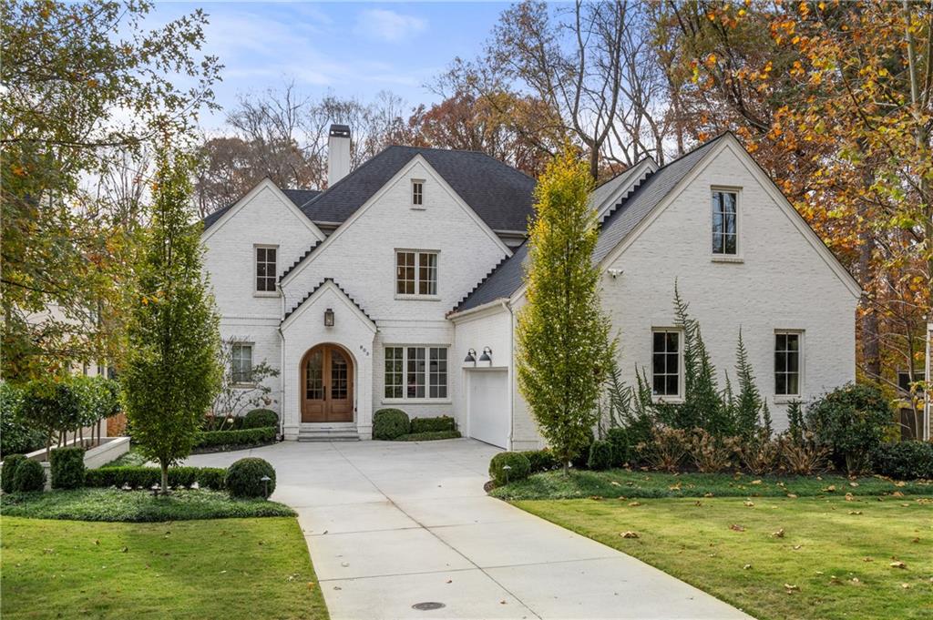 This stunning custom residence offers unparalleled luxury on a rare ½-acre Morningside lot. Boasting over 6,300 +/- square feet of finished space across three levels, this home provides both elegance and versatility. The expansive floor plan features 10-foot ceilings on the main level, an open kitchen equipped with a quartzite stone island, and top-of-the-line Thermador appliances, including a Gas Pro Harmony® range and a Miele integrated coffee maker. The breakfast nook with banquette seating is perfect for casual gatherings, while the adjacent family room and screened porch with Control4 smart home integration and built-in speakers create an ideal ambiance for both intimate evenings and lively parties. Additional highlights on the main level include a junior primary suite, a sophisticated office/parlor with a secret wet bar, a butler’s pantry, and a spacious mudroom/drop zone. The upper-level houses four generously sized bedrooms, each with its own full bathroom, ensuring comfort and privacy for family and guests alike. Descending to the terrace level, you’ll discover 12-foot ceilings, an au pair suite with a bedroom and full bath, a second full laundry room, a gym with rubber flooring, and a media area with stained concrete flooring. Extensive built-ins with a daybed, a wet bar, and a dry-under covered terrace with additional daybeds provide versatile spaces. Step outside where landscaped grounds offer ample space for a future pool. The covered deck features a wood-burning fireplace and a TV, while the open deck provides access to the greenspace and fire pit below. Every detail of this exceptional home, from the integrated smart home technology to the three-car garage featuring an electric charging station, has been thoughtfully designed to offer the ultimate in luxury living. Don’t miss the opportunity to make this premium Atlanta home your own sanctuary.
