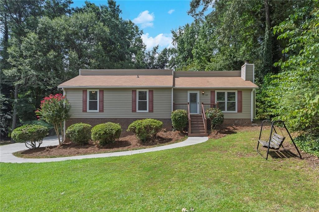 You must come see this adorable ranch home on a cul-de-sac street. Your new home is in an ideal location, just minutes from downtown Woodstock! Woodstock has so much to offer with free concerts in the park, farmers markets, miles of walking trails, a dog park, fantastic entertainment venues, wonderful shops, and restaurants. The home is in a quiet neighborhood away from the hustle and bustle, with a large level open lot. There are four spacious bedrooms and 2 full bathrooms. The beautiful kitchen with SS appliances, granite countertops, and 42" cabinets. Hardwood flooring in the family room. New carpets and fresh paint in the bedrooms. The bathrooms have just been updated. Large closets and lots of storage! Enjoy the heated and cooled sunroom year-round with plenty of natural light and peaceful views of your private backyard. The windows are energy efficient to keep those utility bills low. Upgraded vinyl siding on the exterior for easy maintenance. The charming front porch is Trex decking. The unfinished basement is awaiting your finishing touches. The driveway is long and level for when guests arrive. Over half an acre for plenty of room for entertaining or gardening. No HOA! Make an appointment to see this home today!